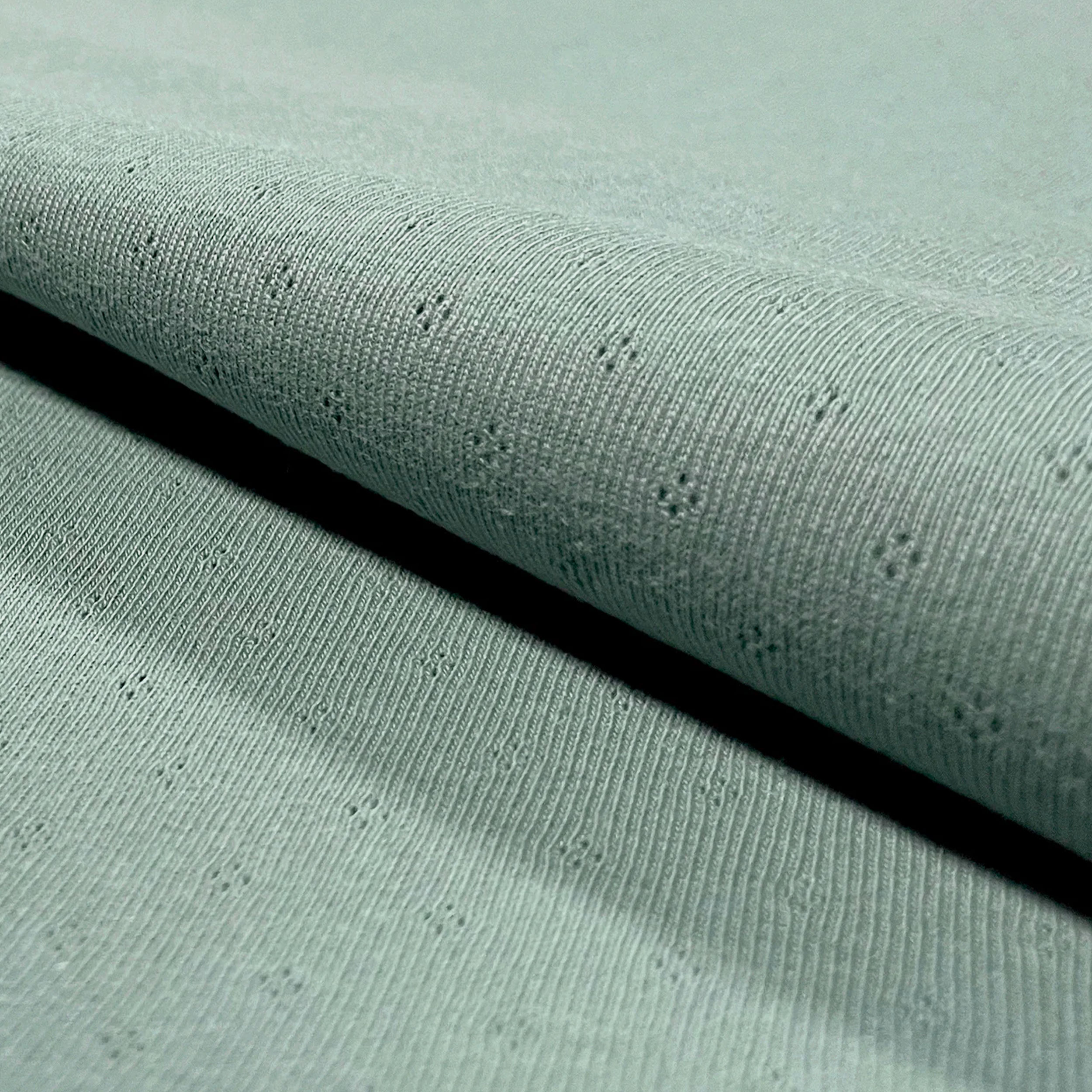Jersey Cotton Jersey Perforated Flowers on a Mint Background