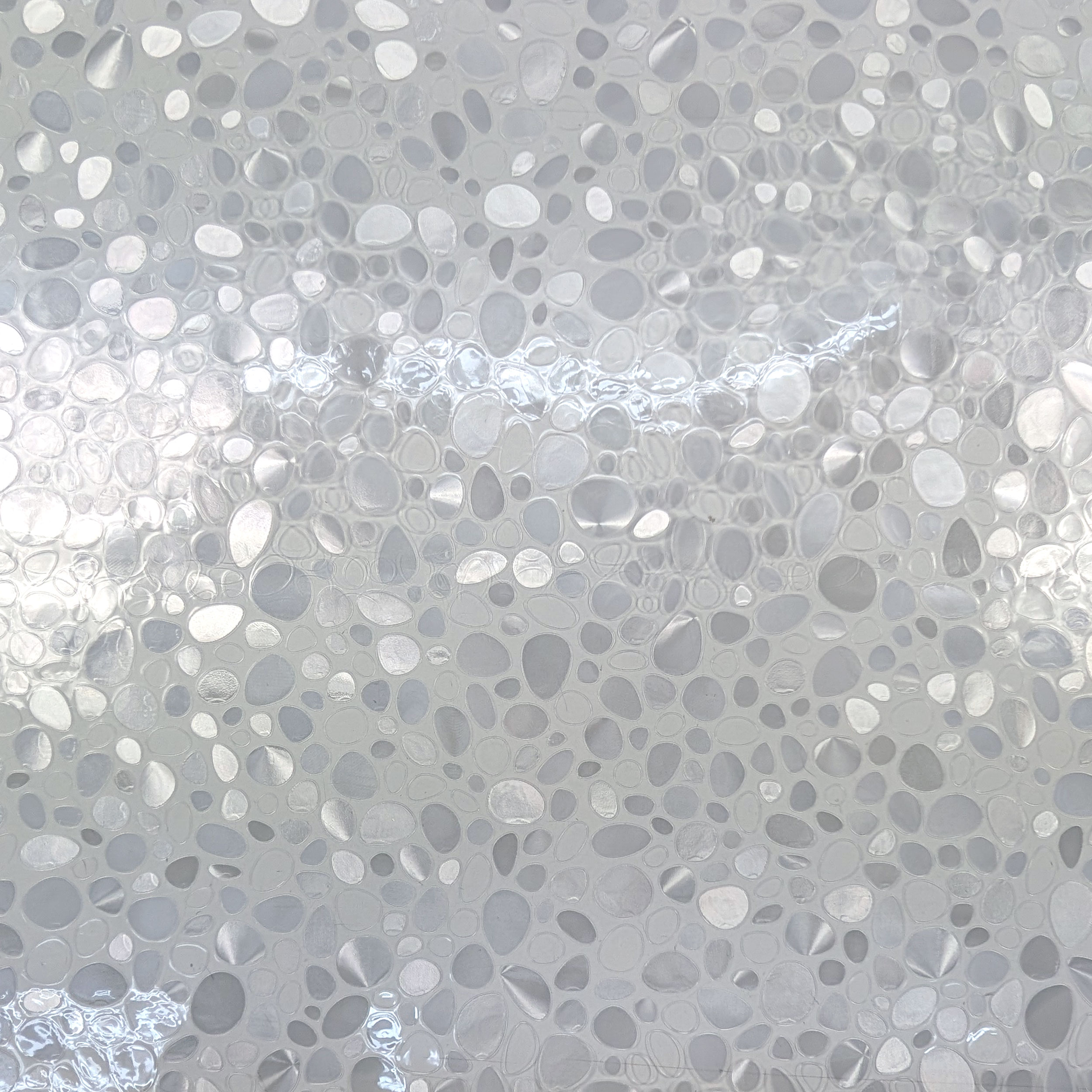Plastic-coated table cover with pebbles Image