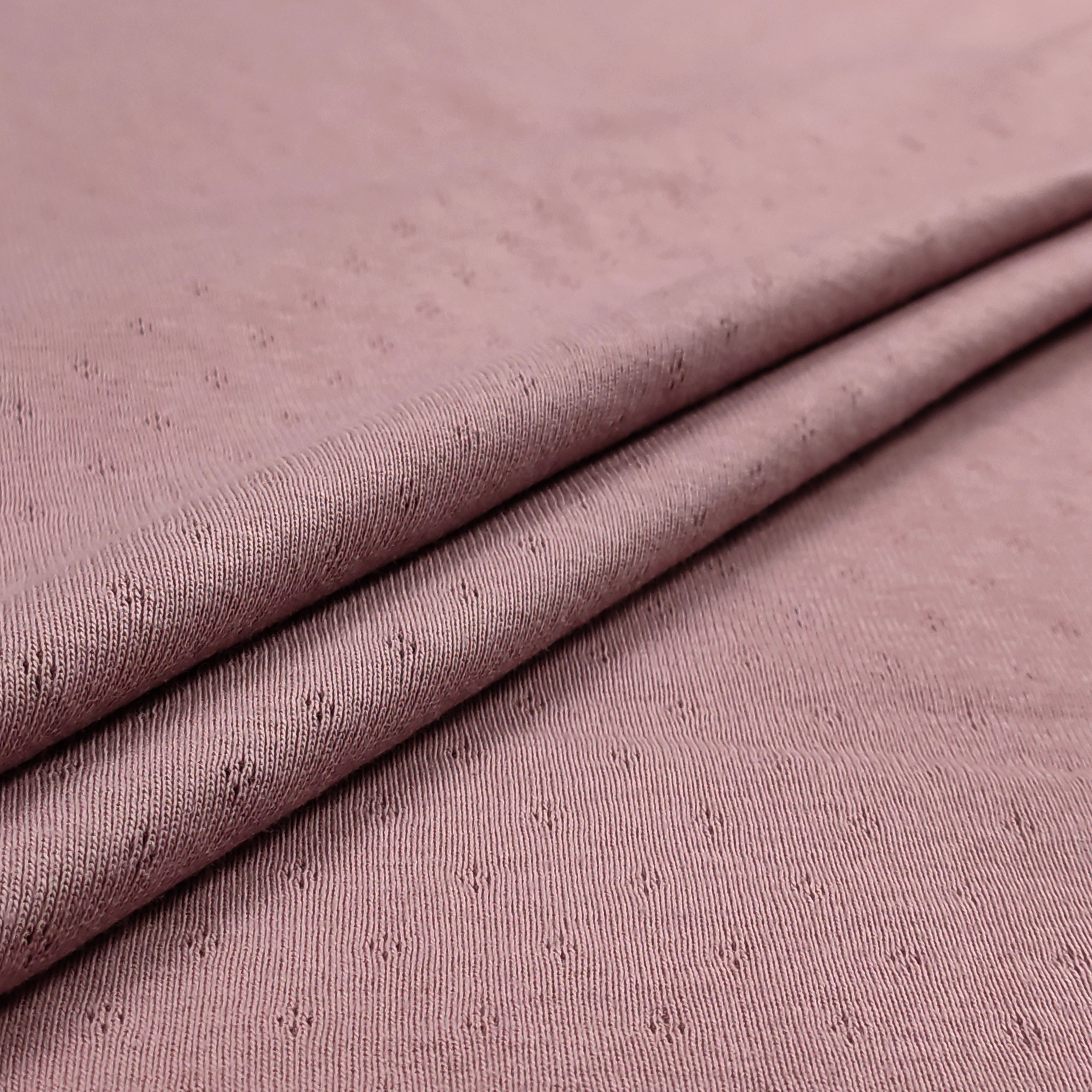 Jersey Cotton Jersey Perforated Flowers on a Pink Background Image
