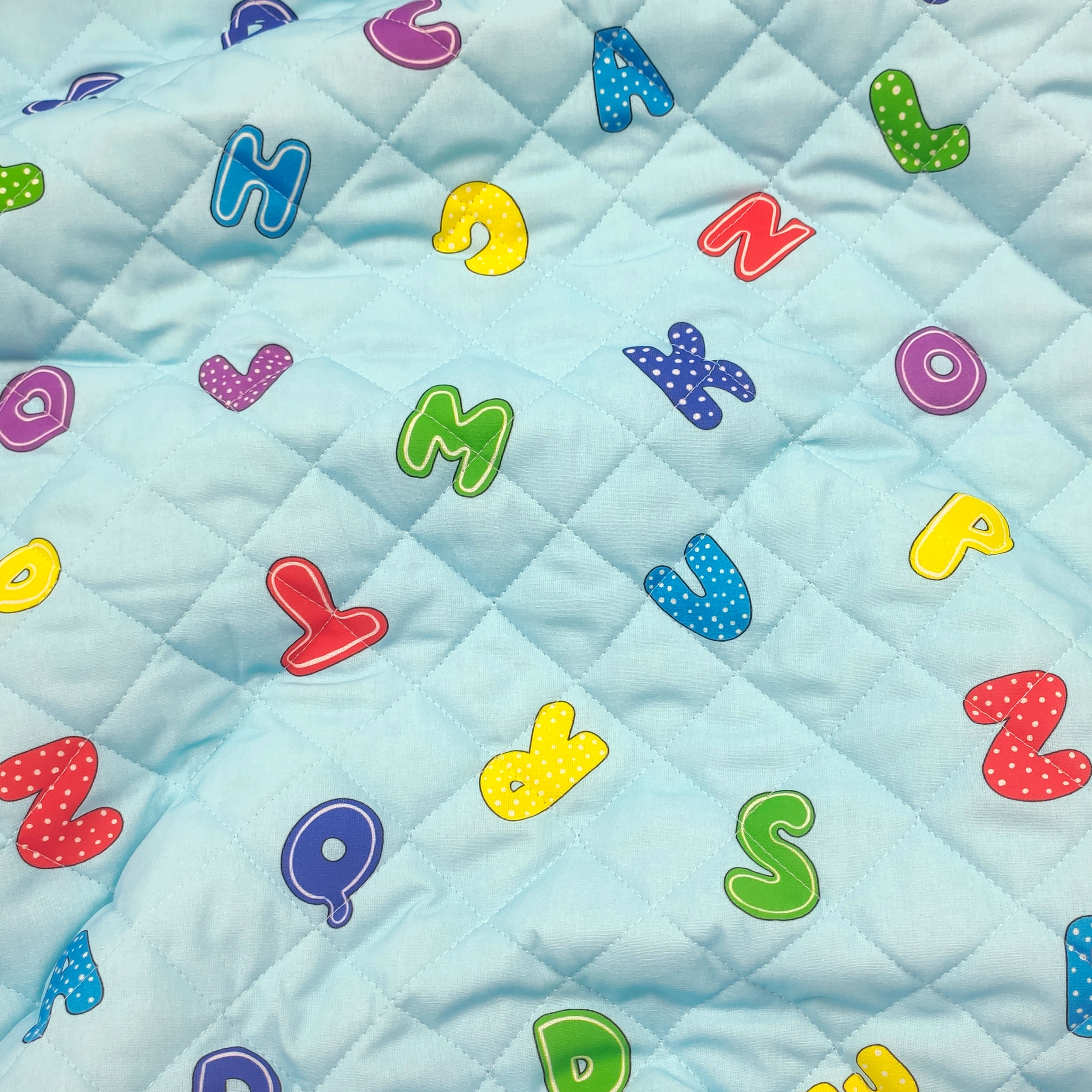 Alphabet Quilted Fabric Light Blue Background Image