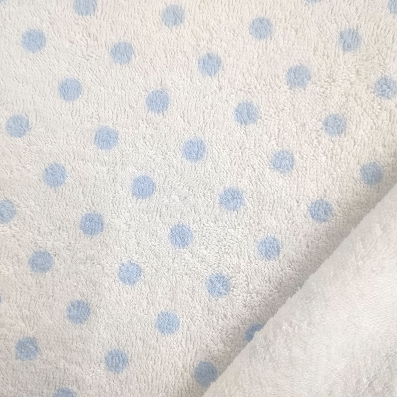 Tela esponja estampada de lunares azul claro