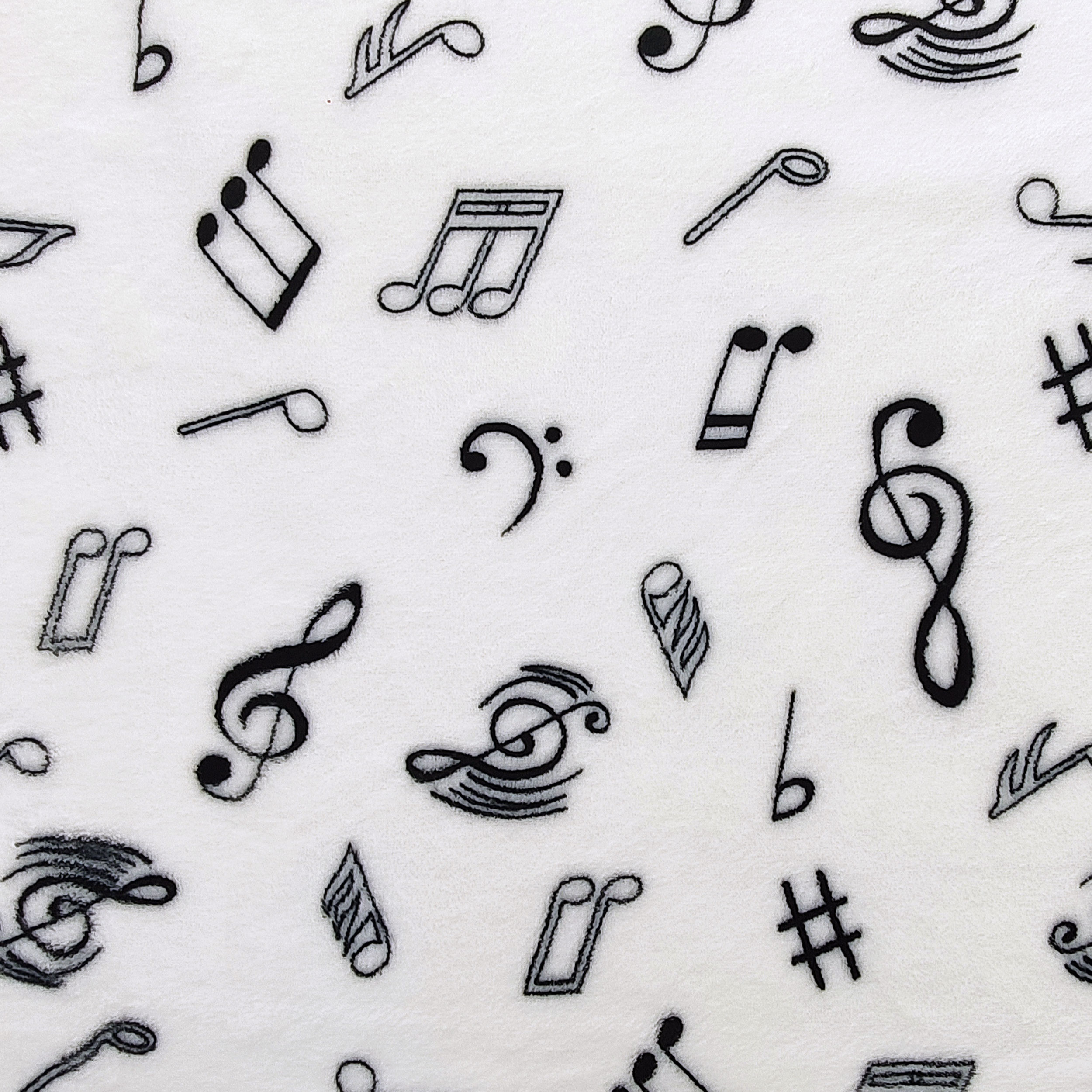 Vellón de cachemira blanco con notas musicales