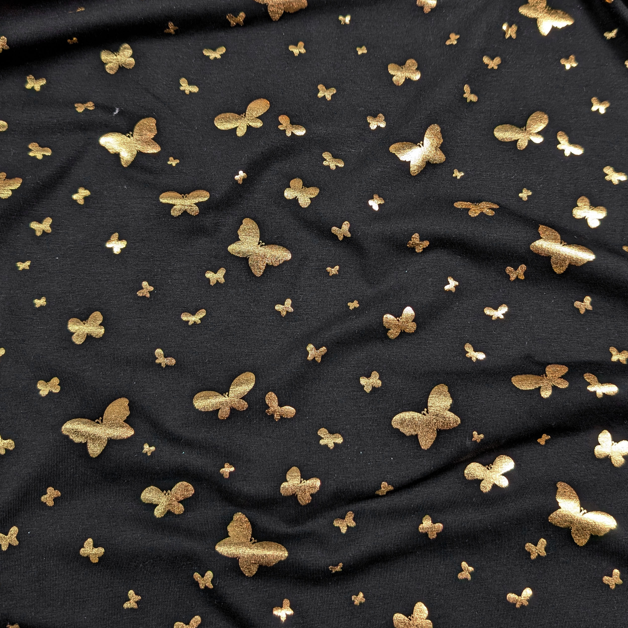 Black cotton jersey with gold butterflies Image