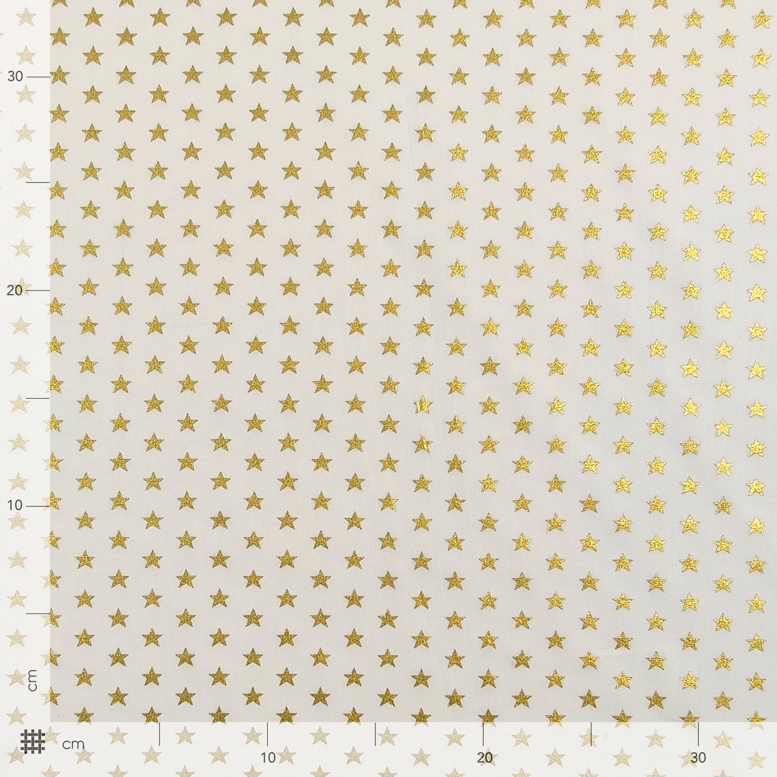 Tela de algodón Estrellas Lurex Fondo Dorado Blanco