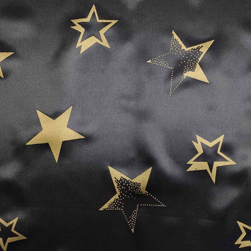 Schwarzer Karnevals-Satin-Stoff mit goldenen Sternen