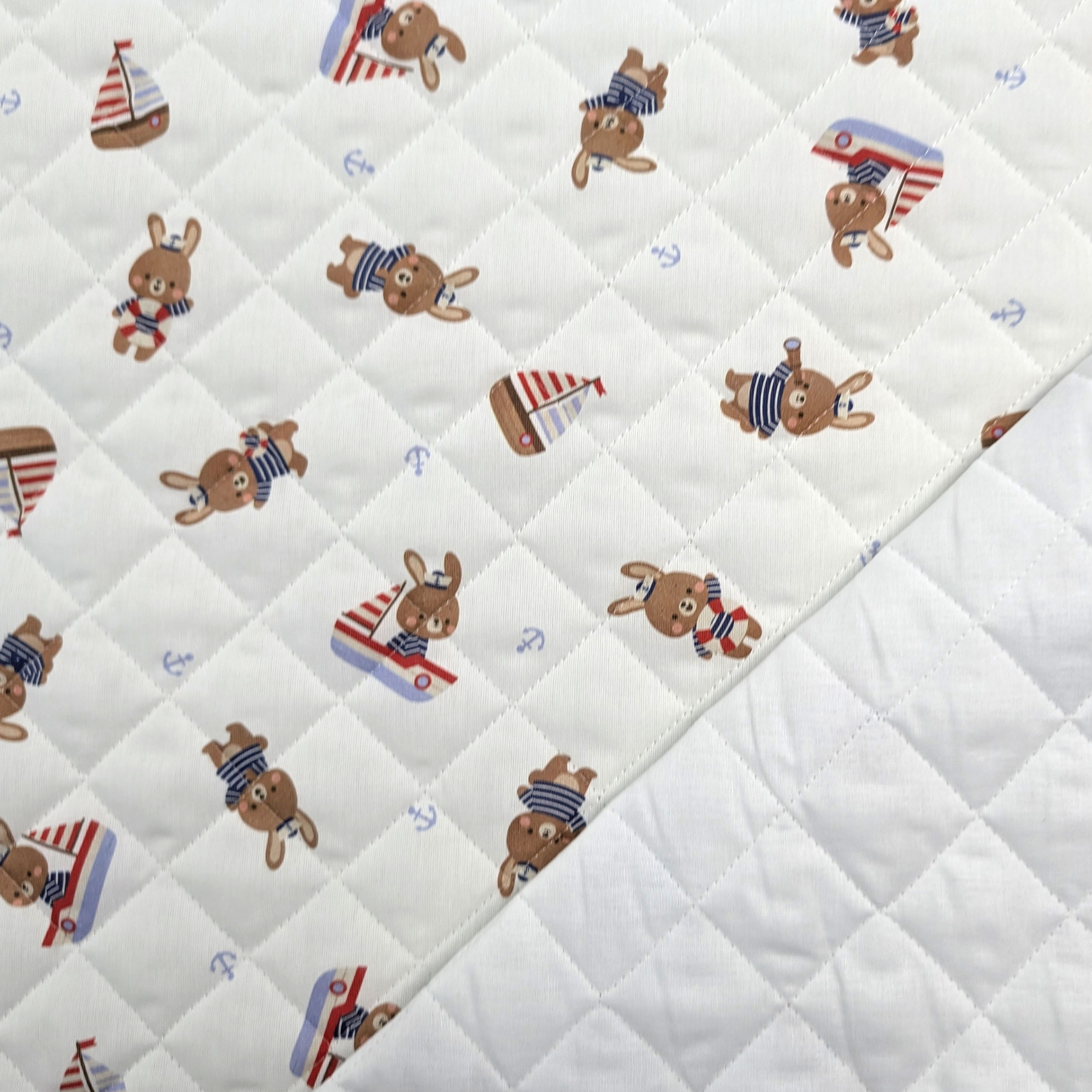Quilted Fabric Featuring Bunnies in a Boat Image