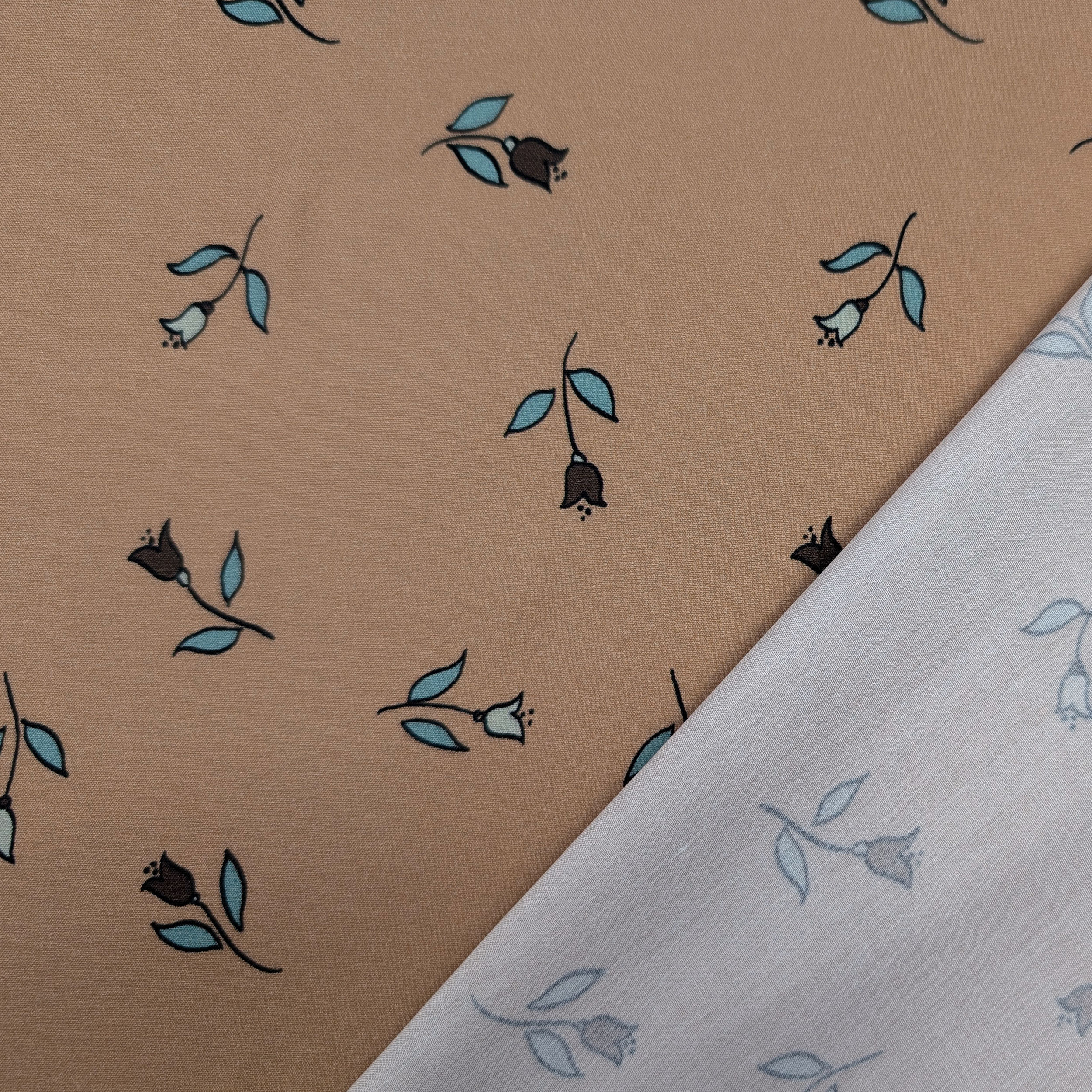 Viscose with a floral pattern on a dark beige background Image
