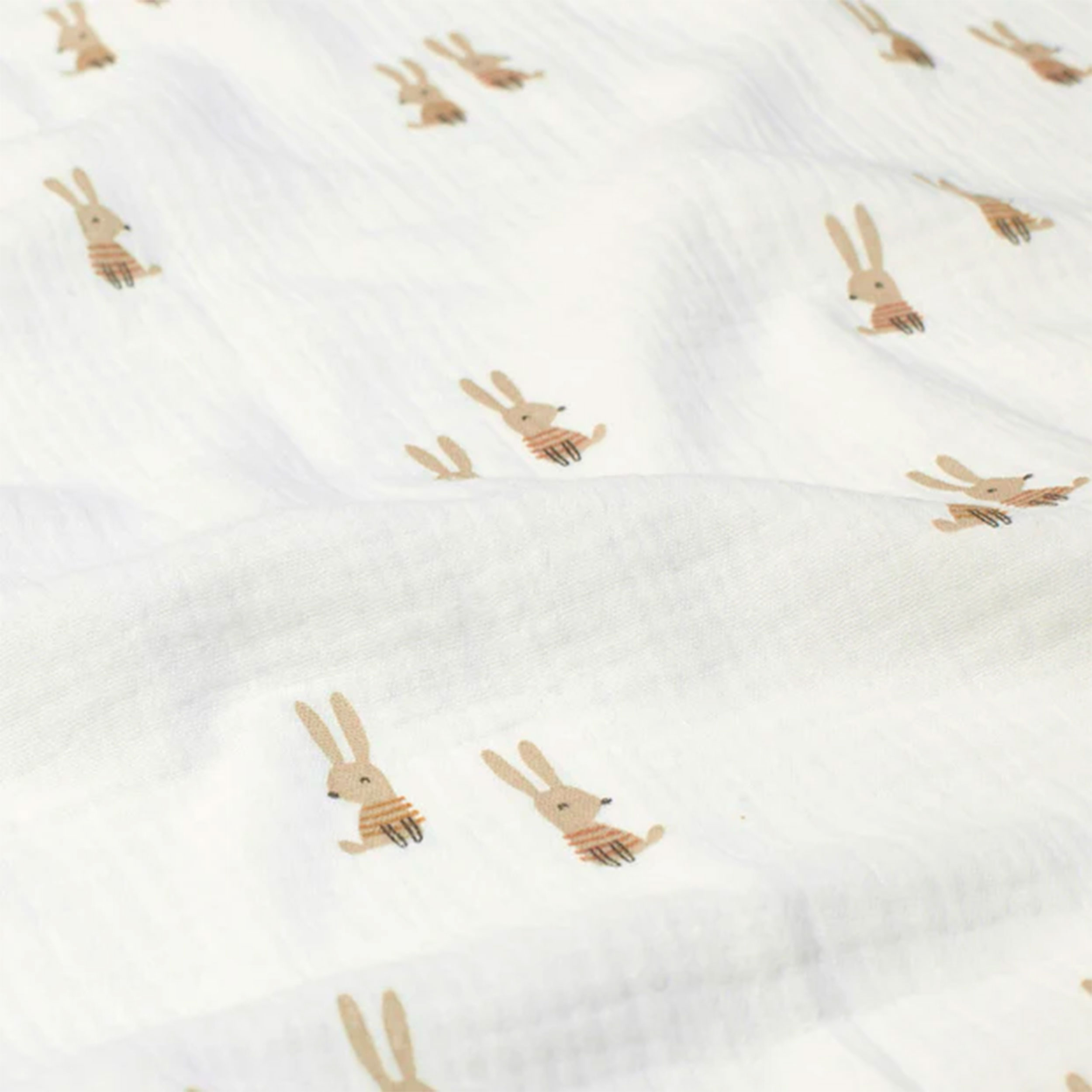 Mousseline de coton blanche avec lapins