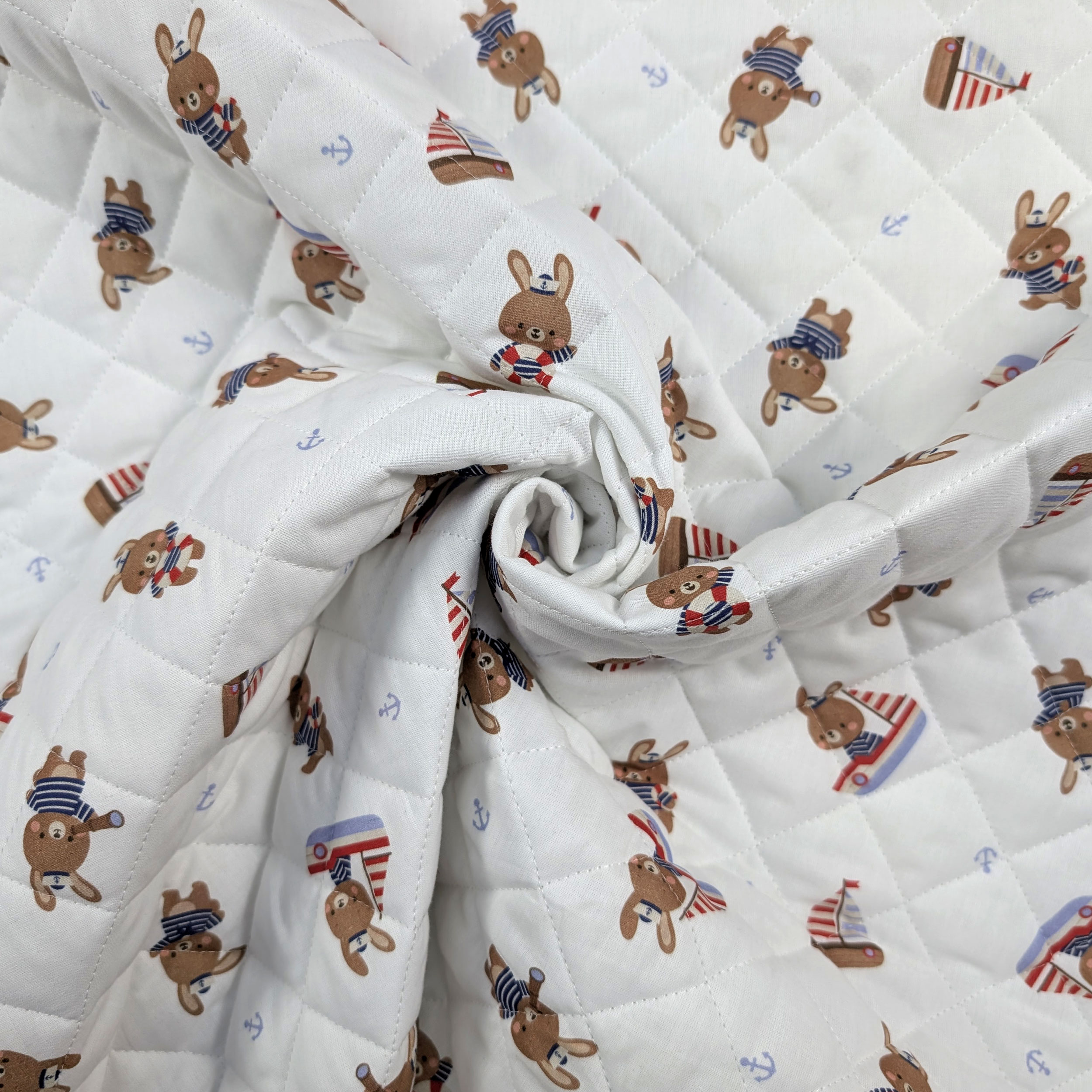 Quilted Fabric Featuring Bunnies in a Boat Image