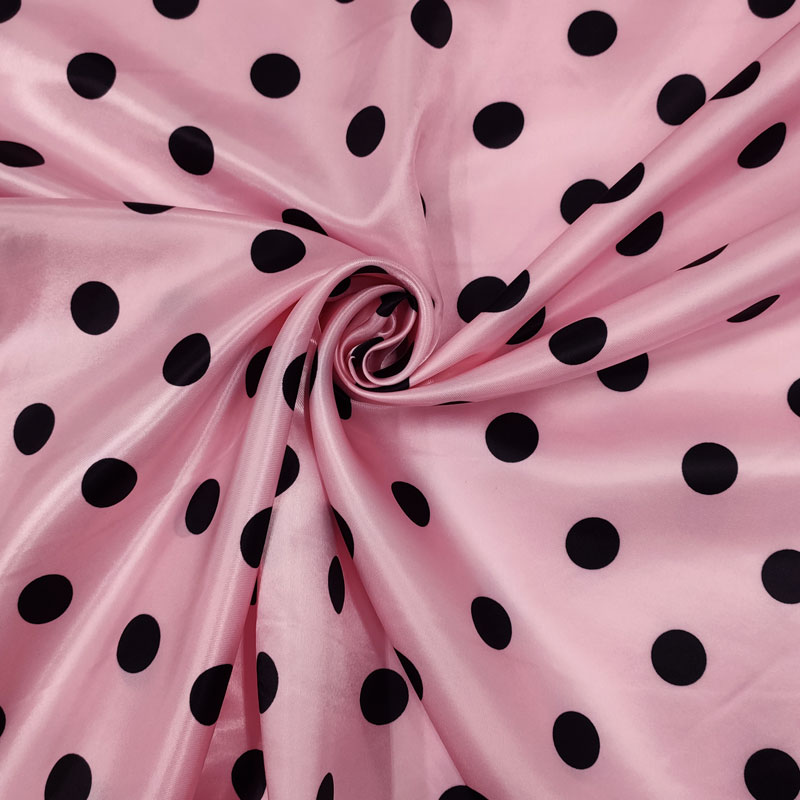 Tissu de satin Carnaval Noir à pois Fond rose Image