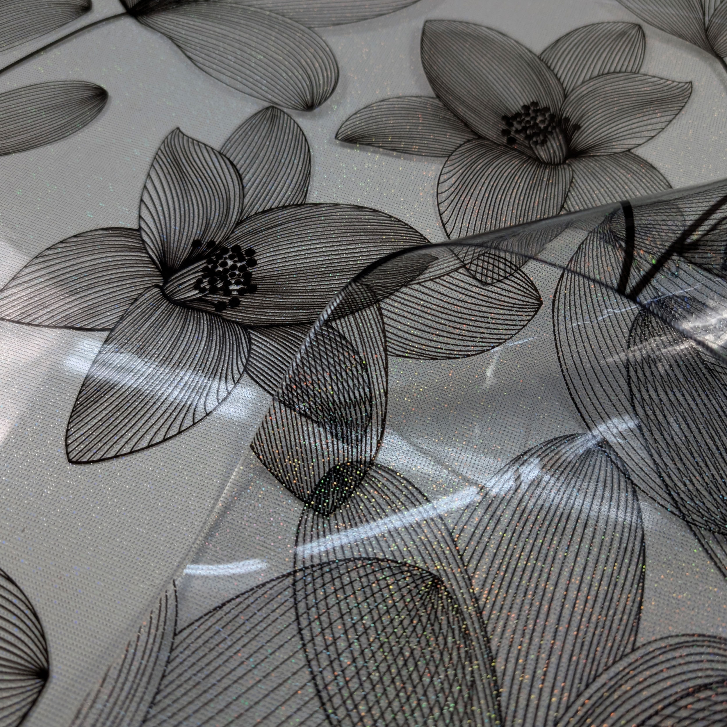 Smoked Black Plasticised Flower Outline Table Cover with Glitter Image