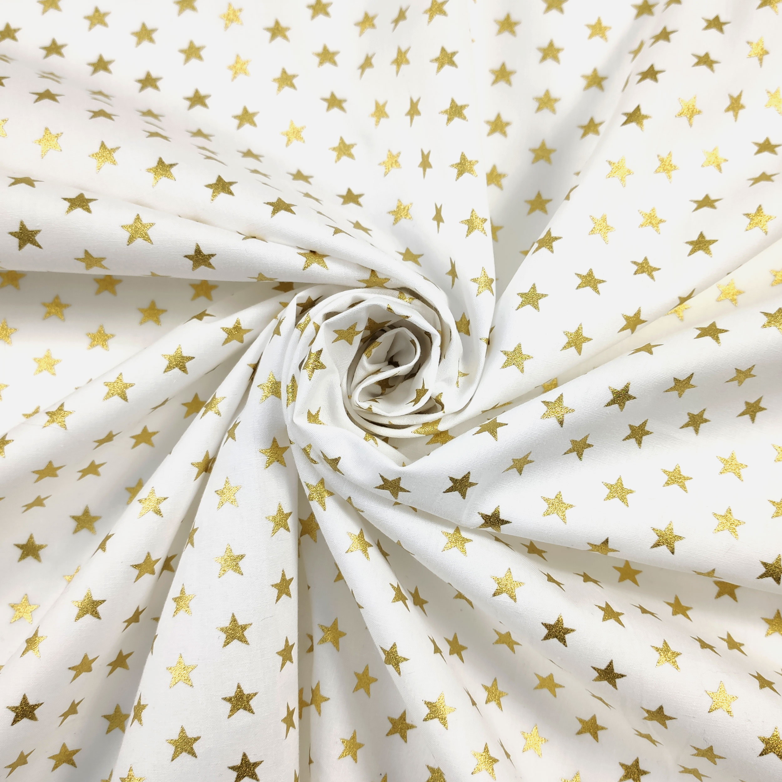 Tela de algodón Estrellas Lurex Fondo Dorado Blanco