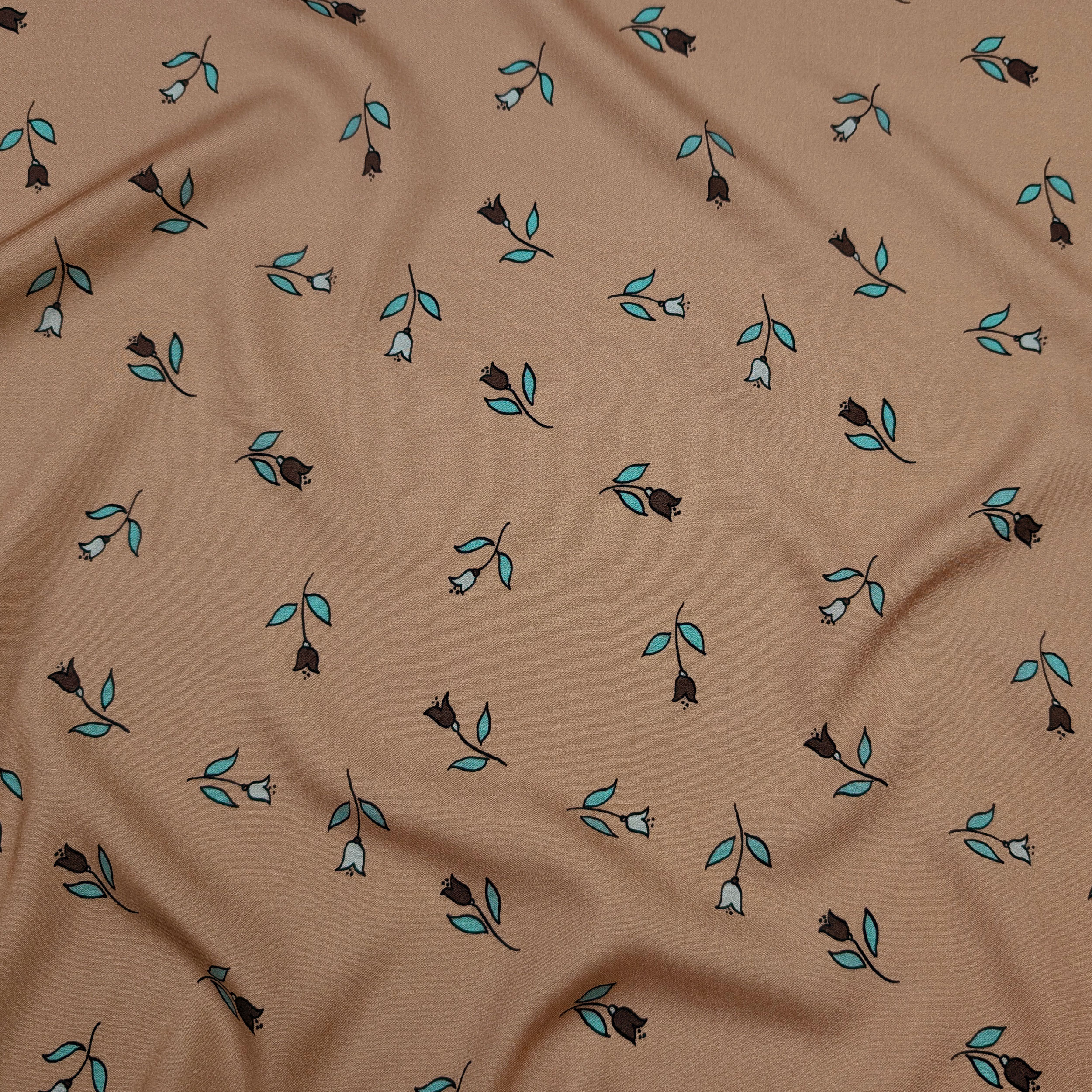 Viscose with a floral pattern on a dark beige background Image