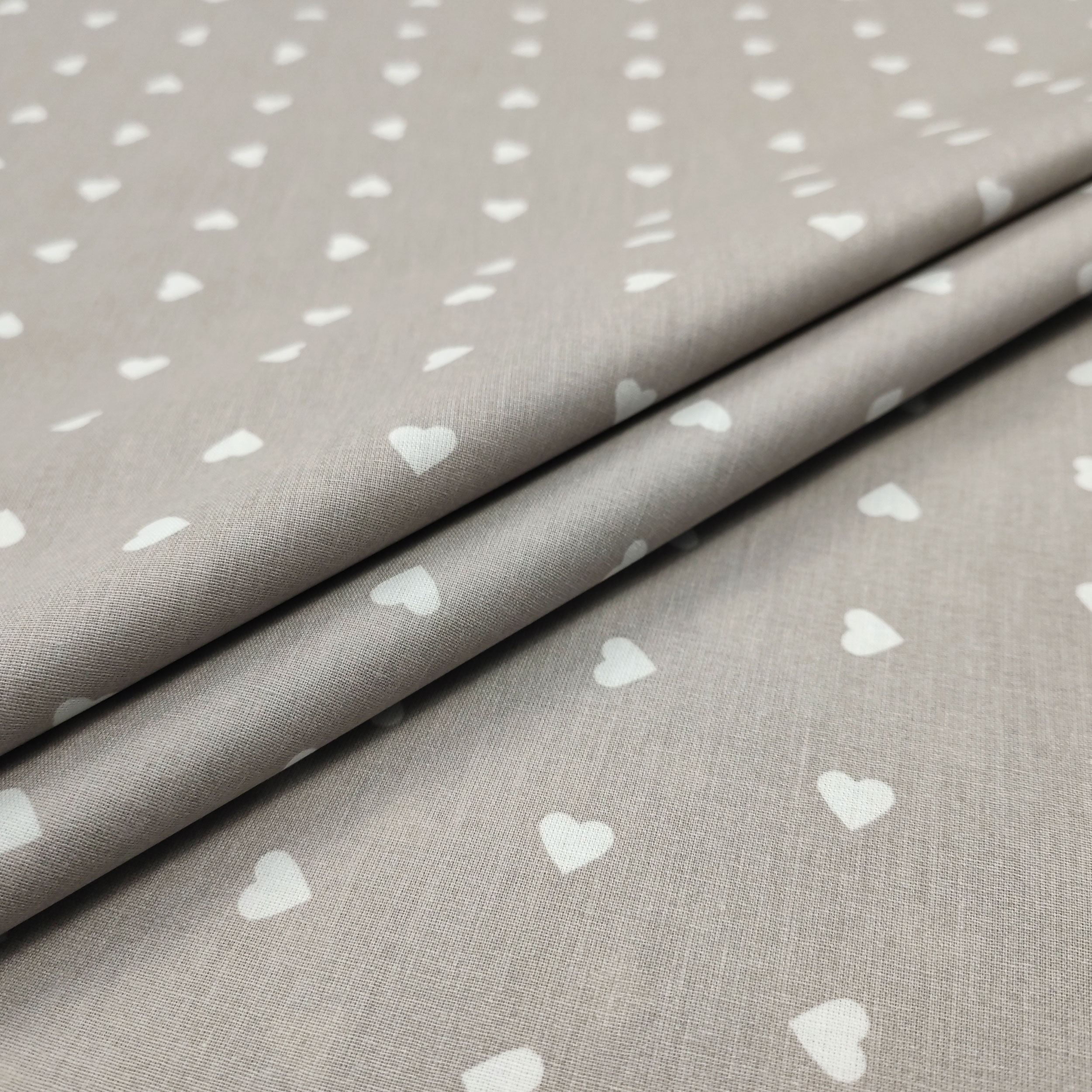 Printed Cotton with White Hearts - Colored Background  Image