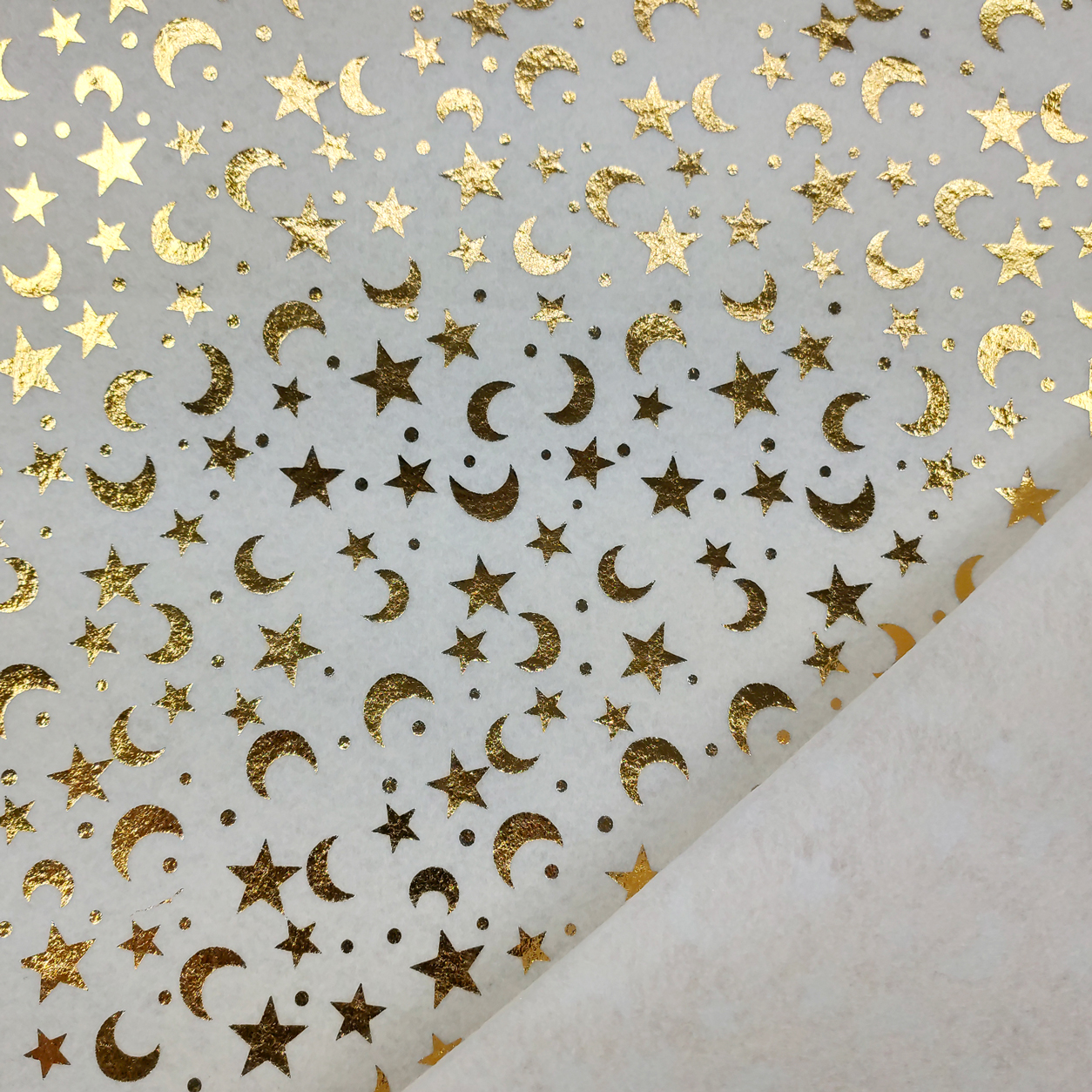 pannolenci-moda-lune-e-stelle-oro-sfondo-panna