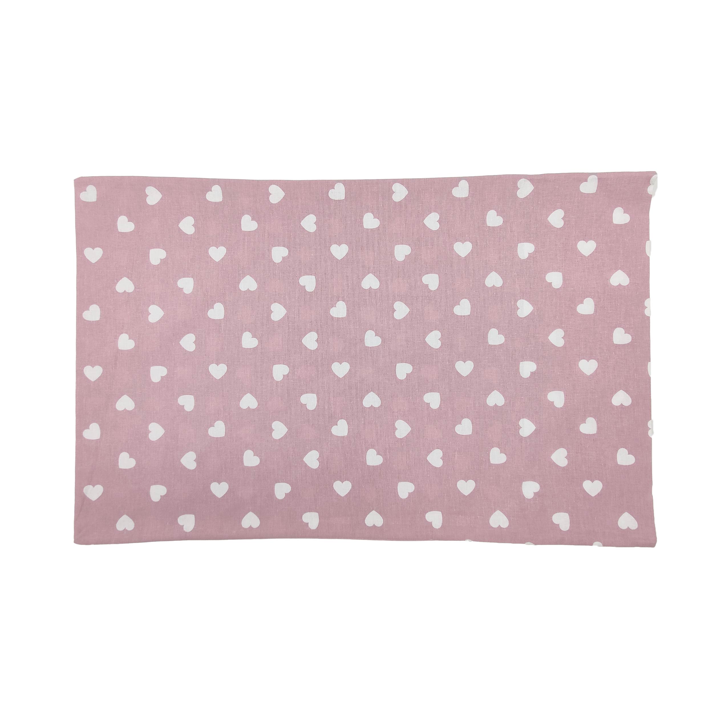 Taie d'oreiller blanche à cœurs sur fond rose antique