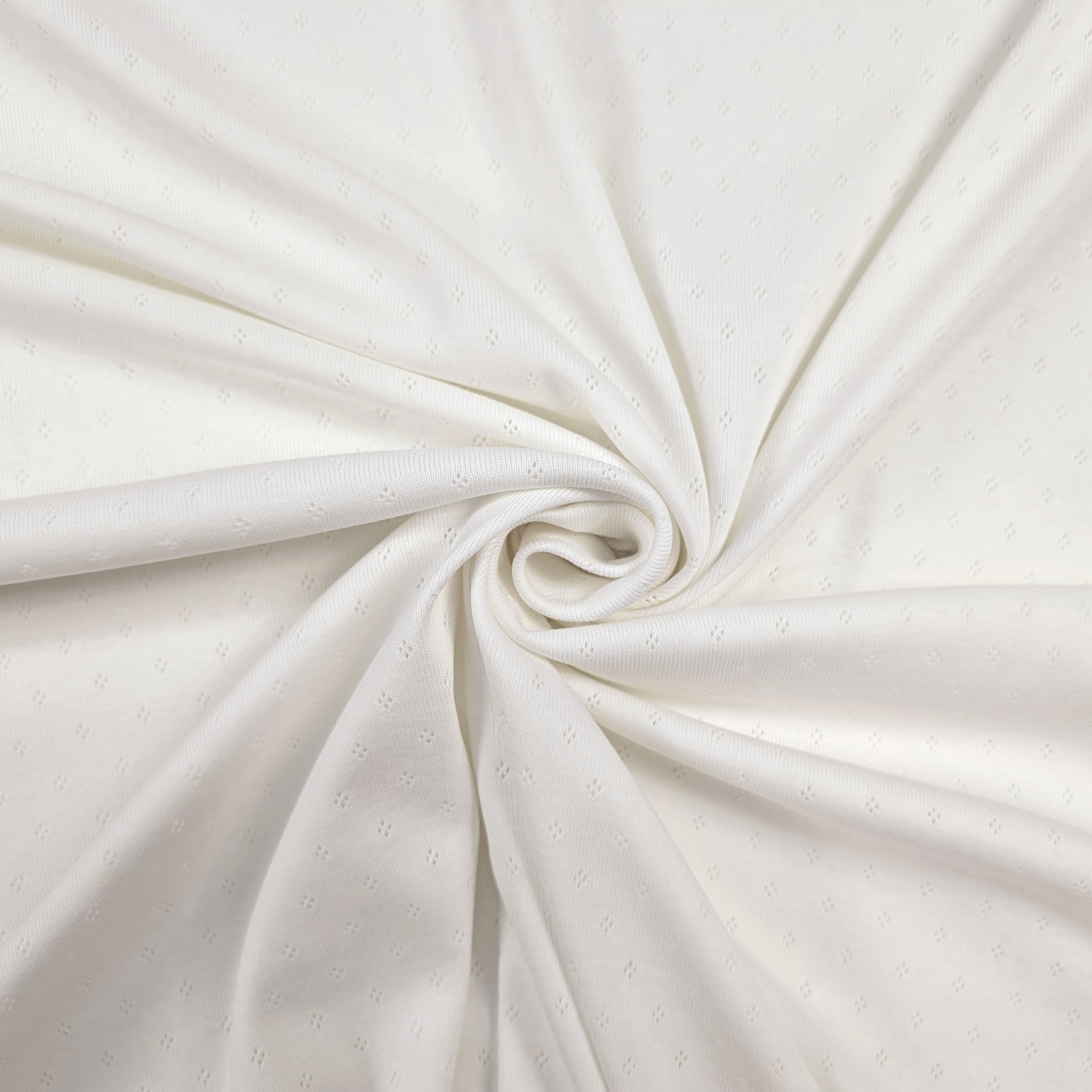Cotton Jersey with Openwork Floral Design on a White Background Image