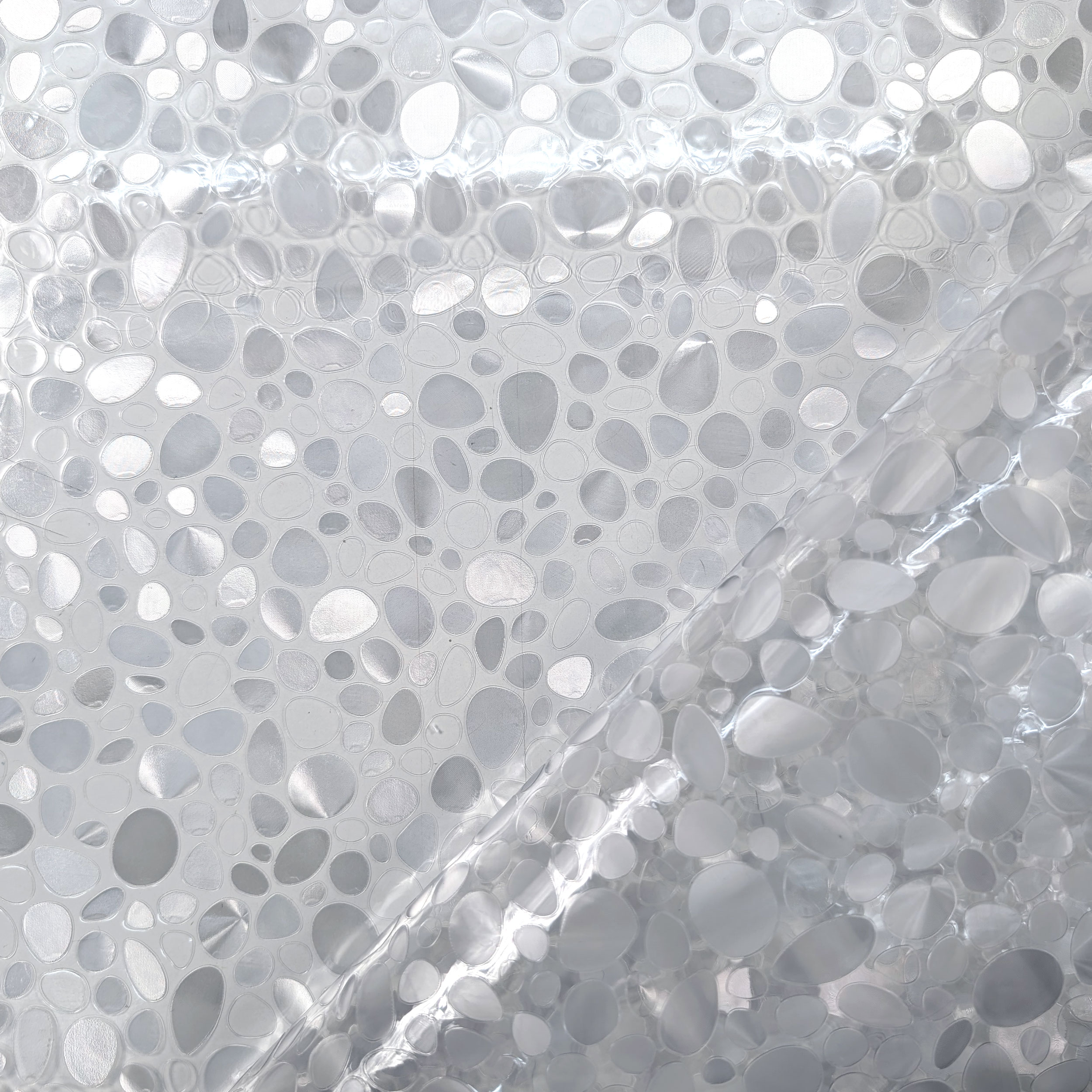 Plastic-coated table cover with pebbles Image