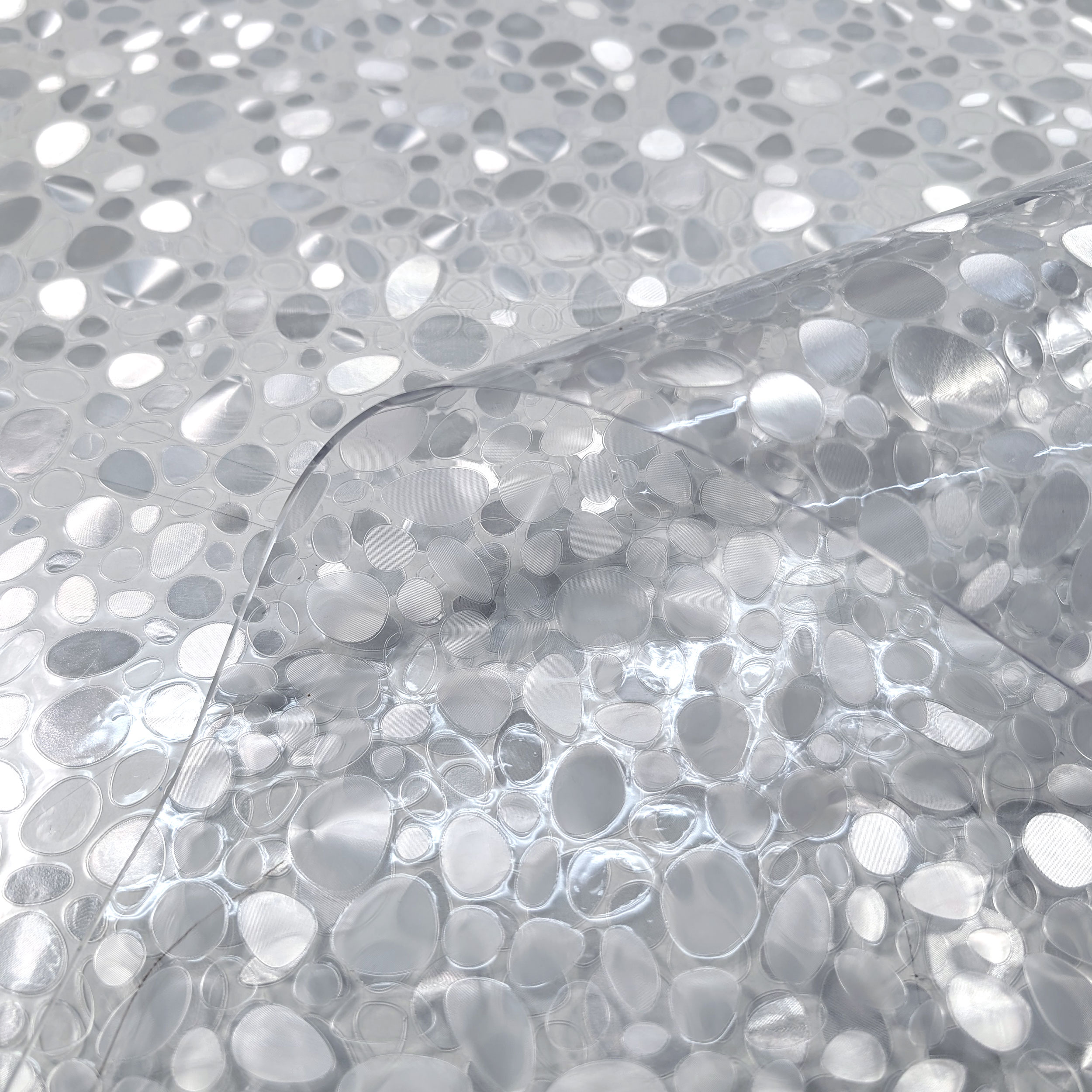 Plastic-coated table cover with pebbles Image