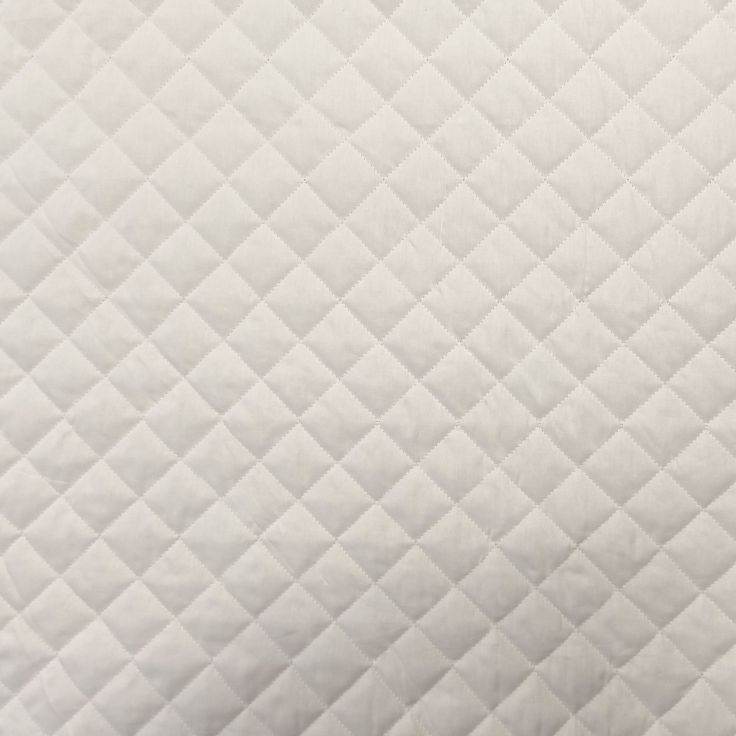 Tejido acolchado blanco