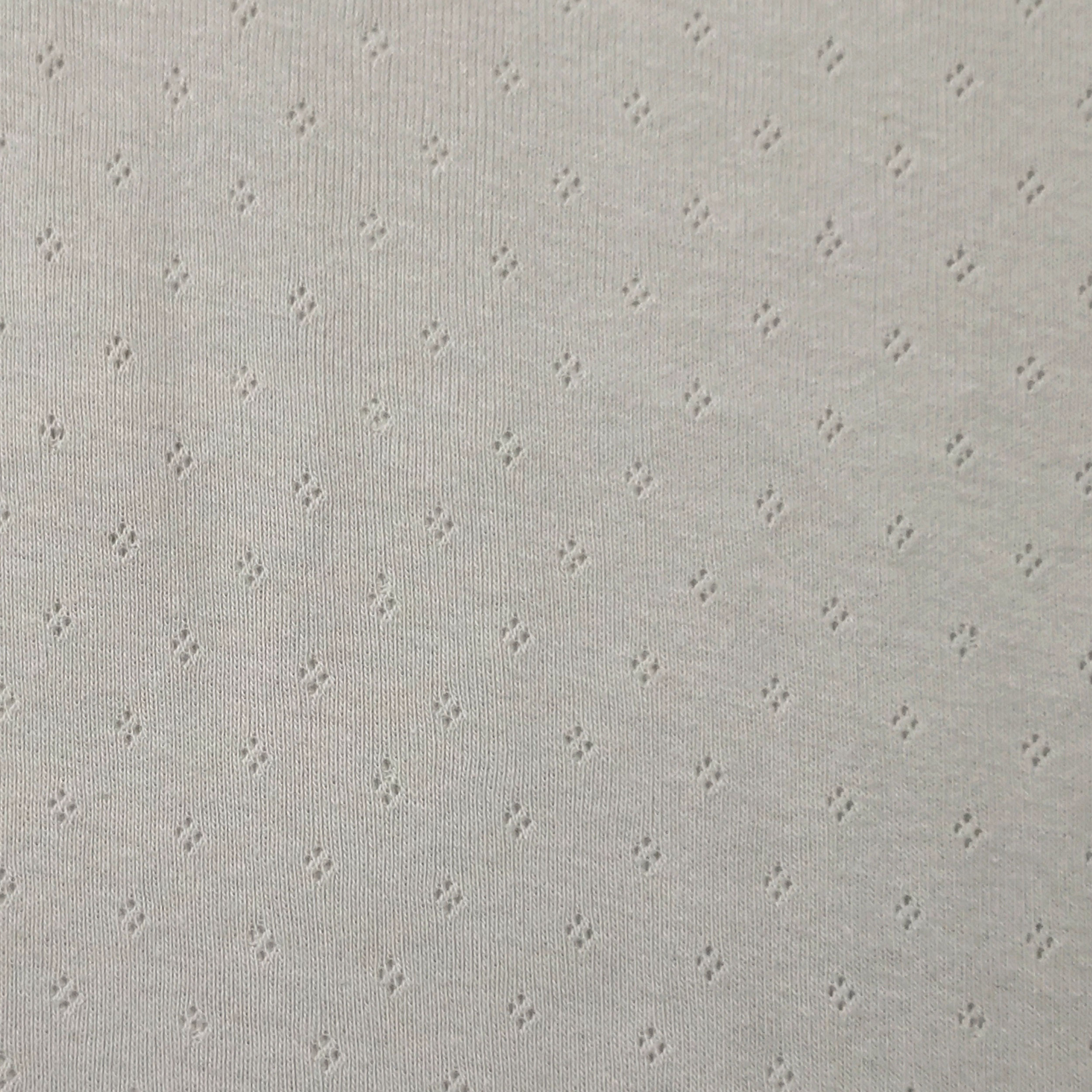 Jersey de coton Jersey de coton Fleurs perforées sur fond gris clair Image