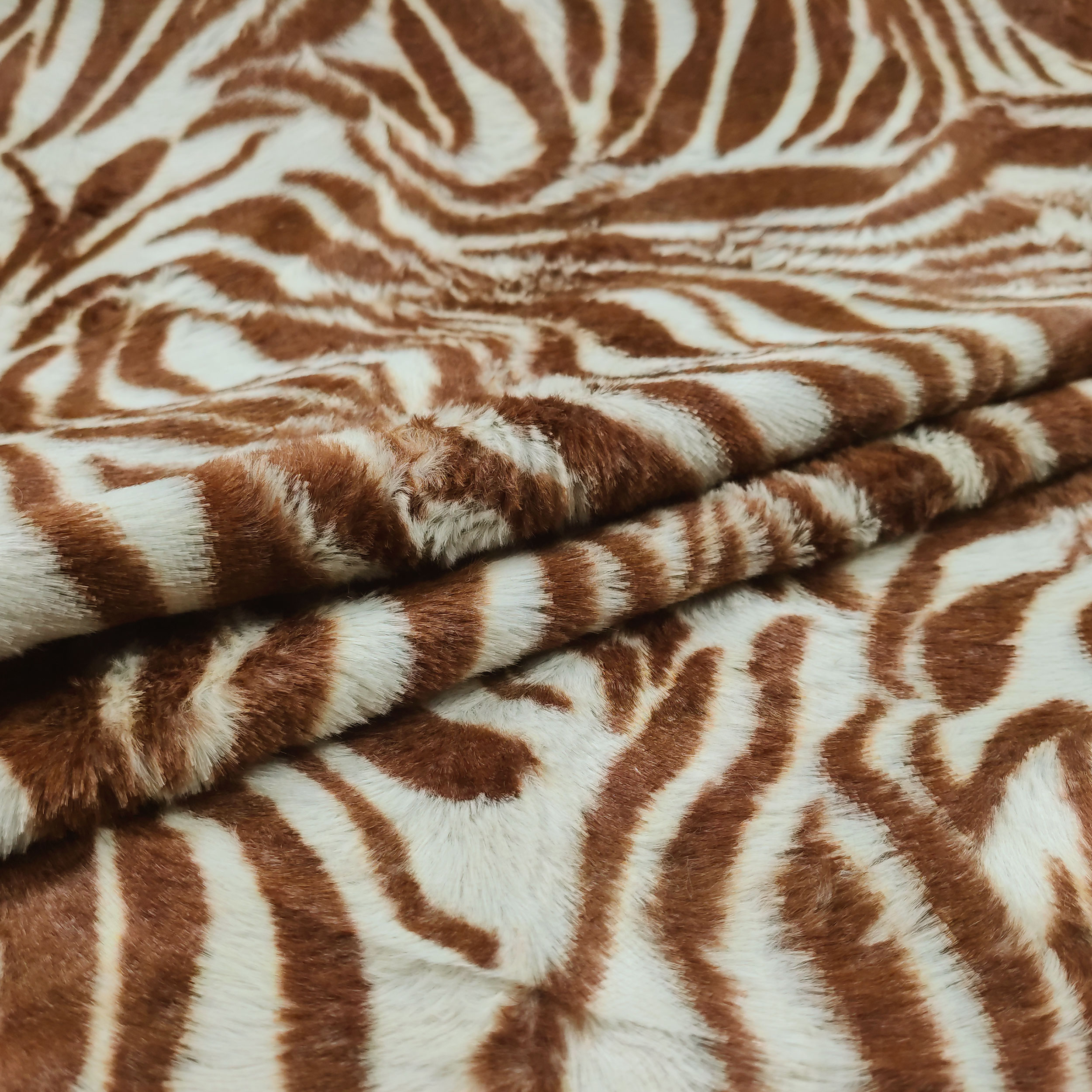 Tela de pelo de poni de tigre marrón claro