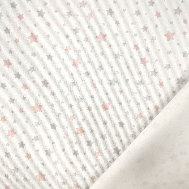 Tela de piqué de algodón con estampado de estrellas rosas