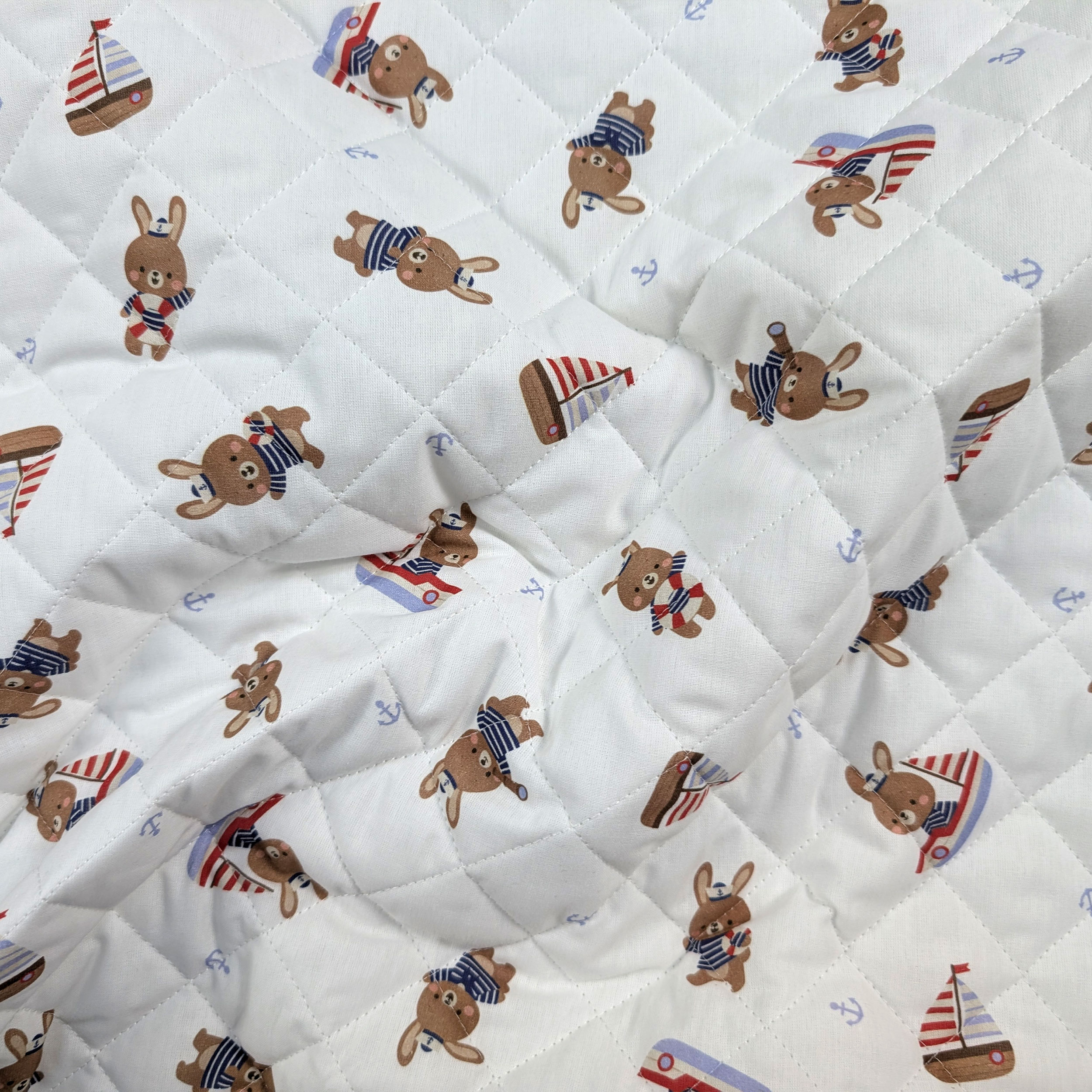 Quilted Fabric Featuring Bunnies in a Boat Image