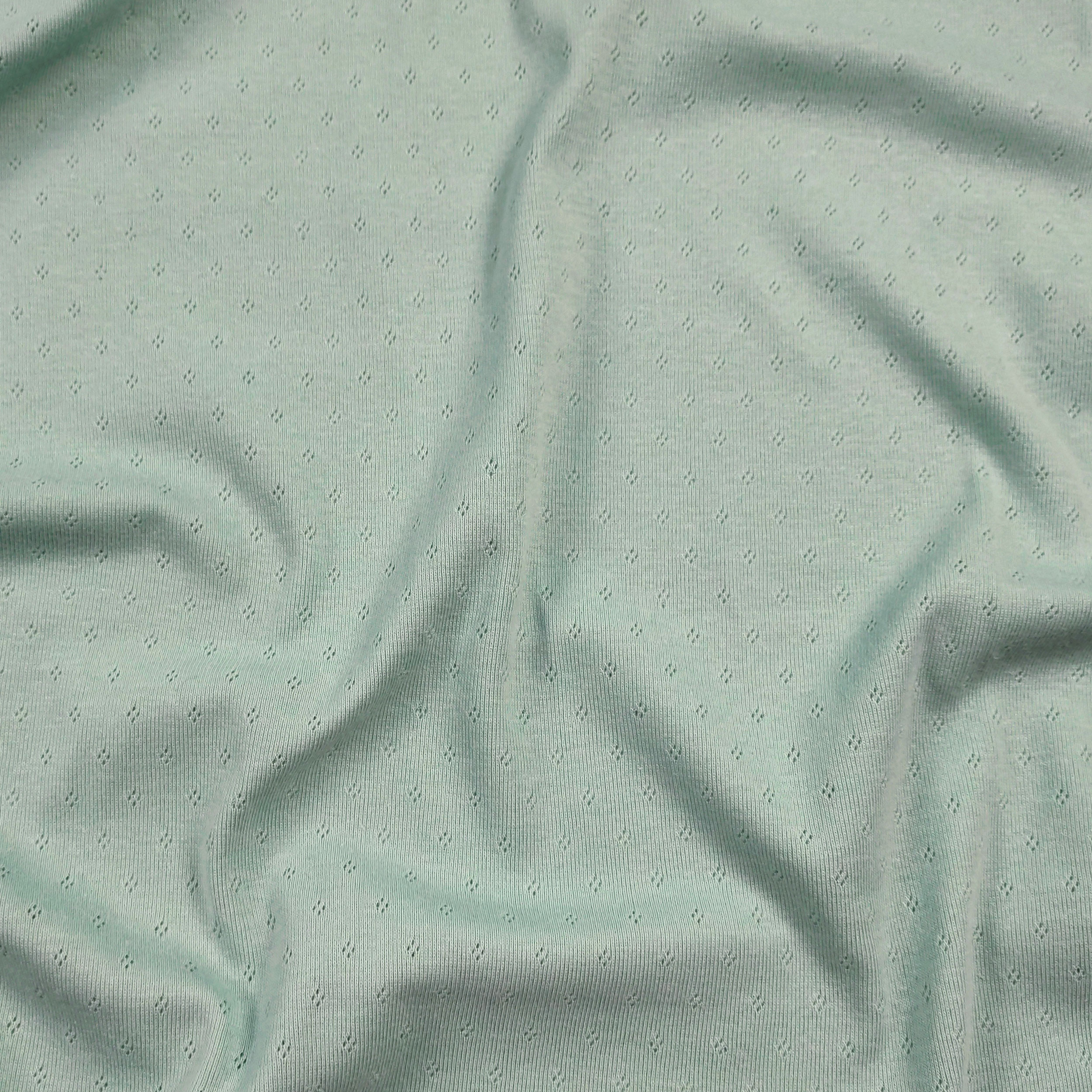 Jersey Cotton Jersey Perforated Flowers on a Mint Background Image