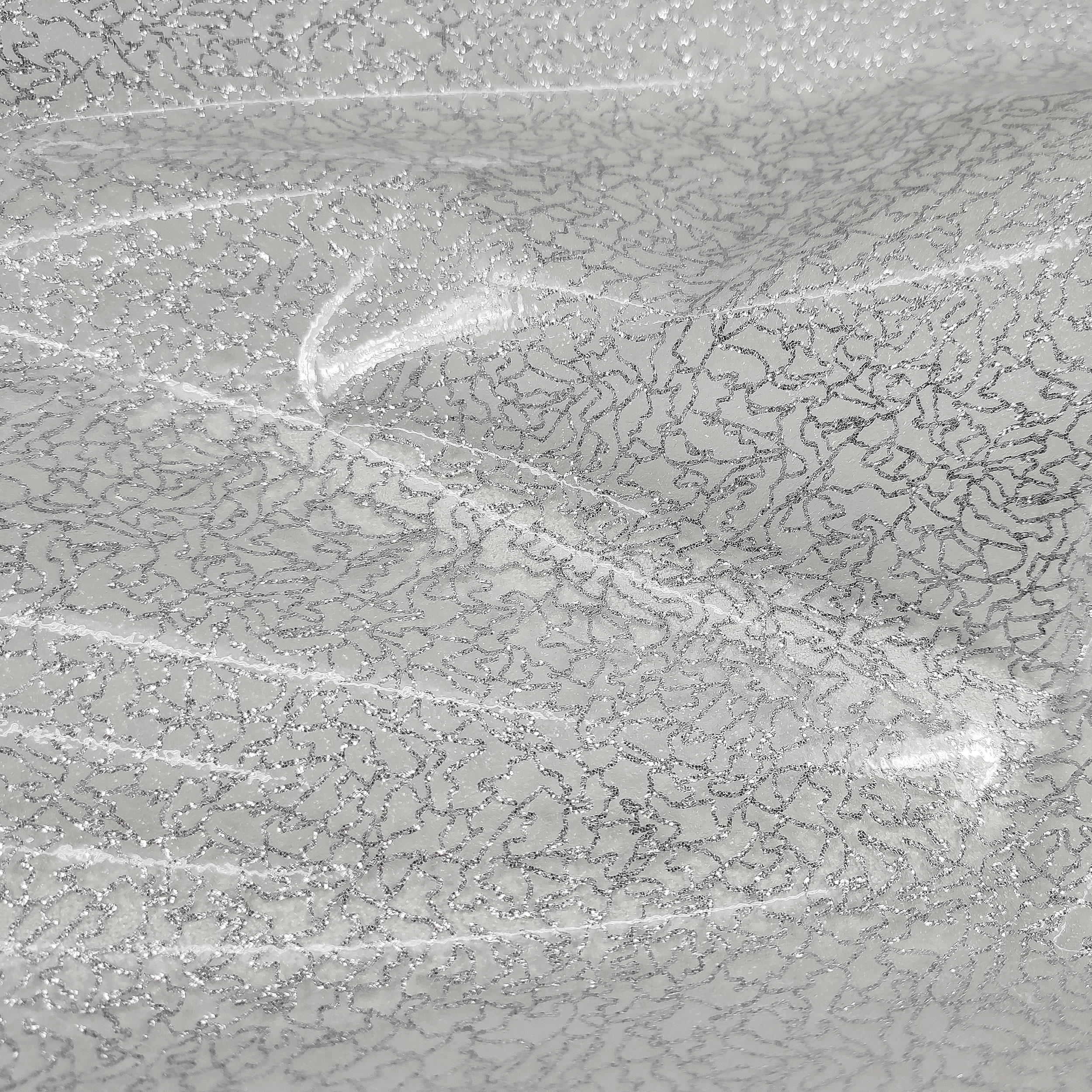 Nappes plastifiées à motifs pailletés argentés