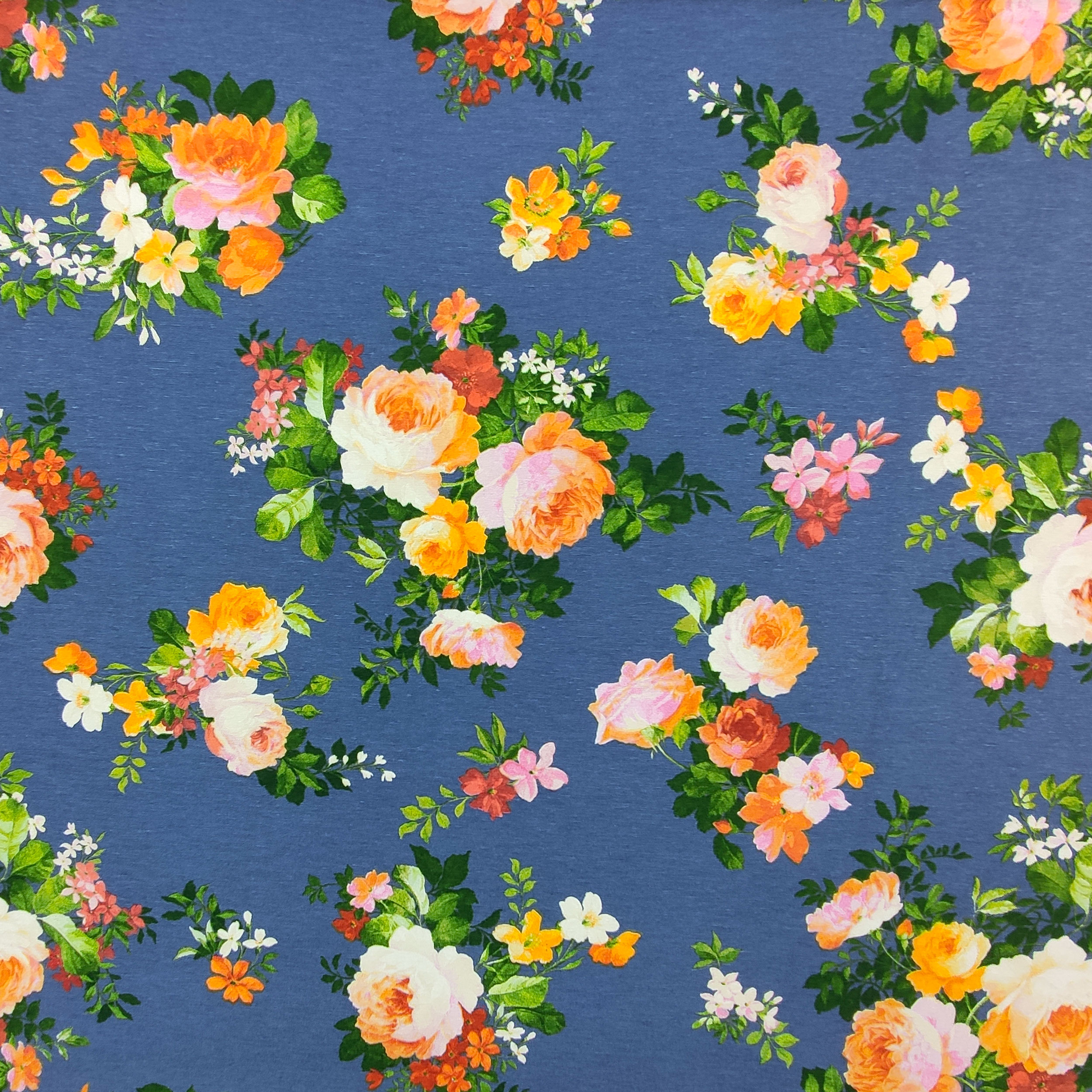 Tejido de algodón mixto Rosas de colores Fondo azul