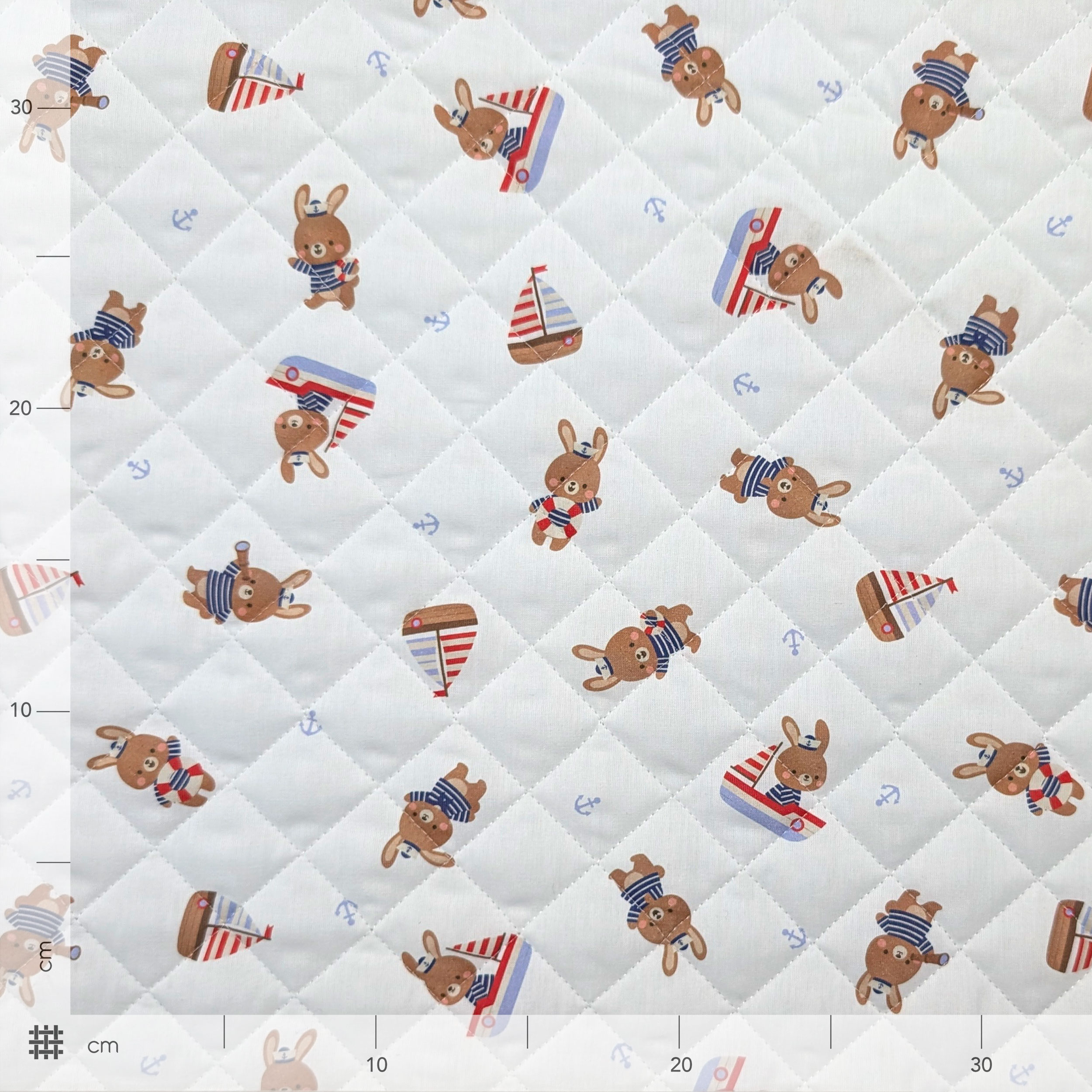 Quilted Fabric Featuring Bunnies in a Boat Image