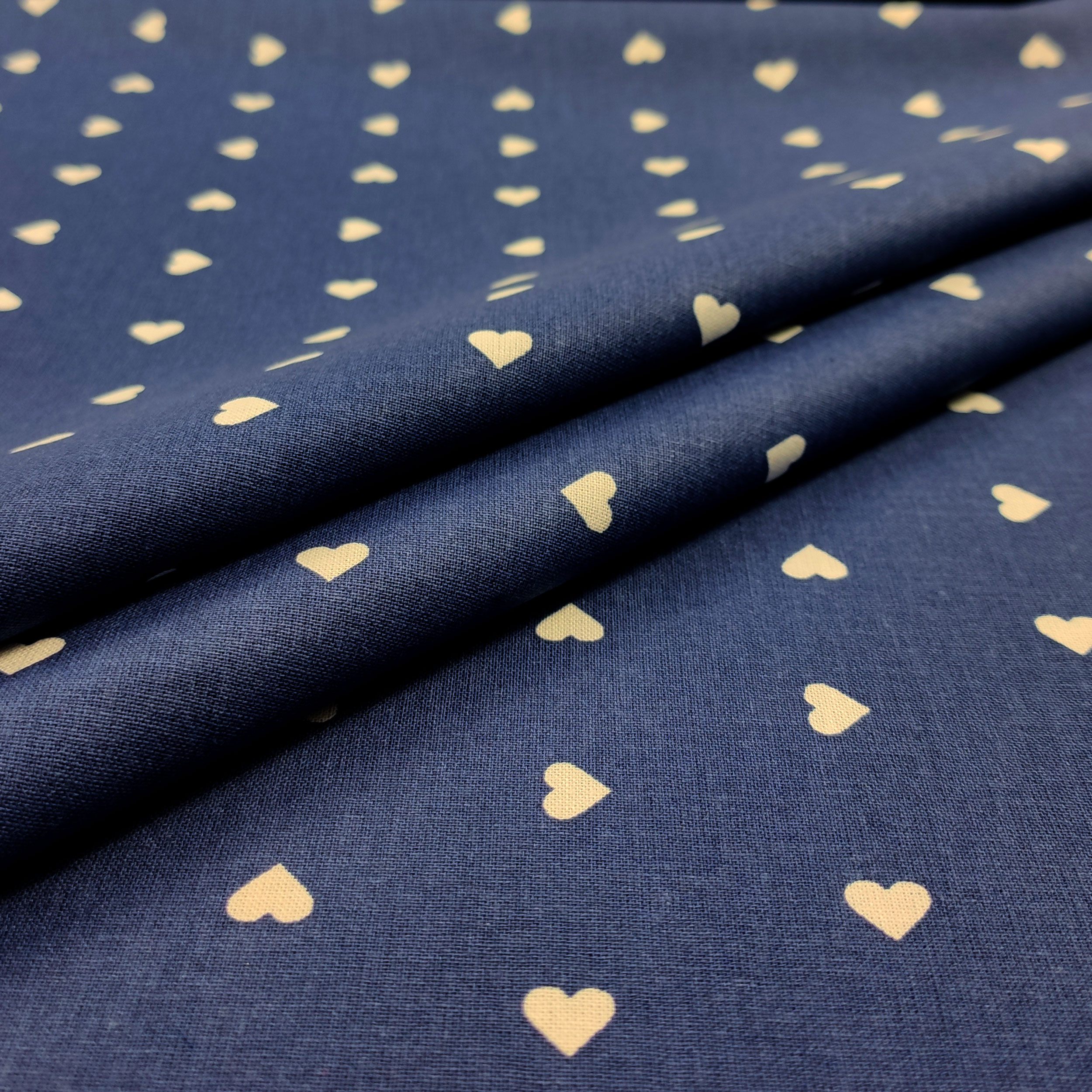 Printed Cotton with White Hearts - Colored Background  Image