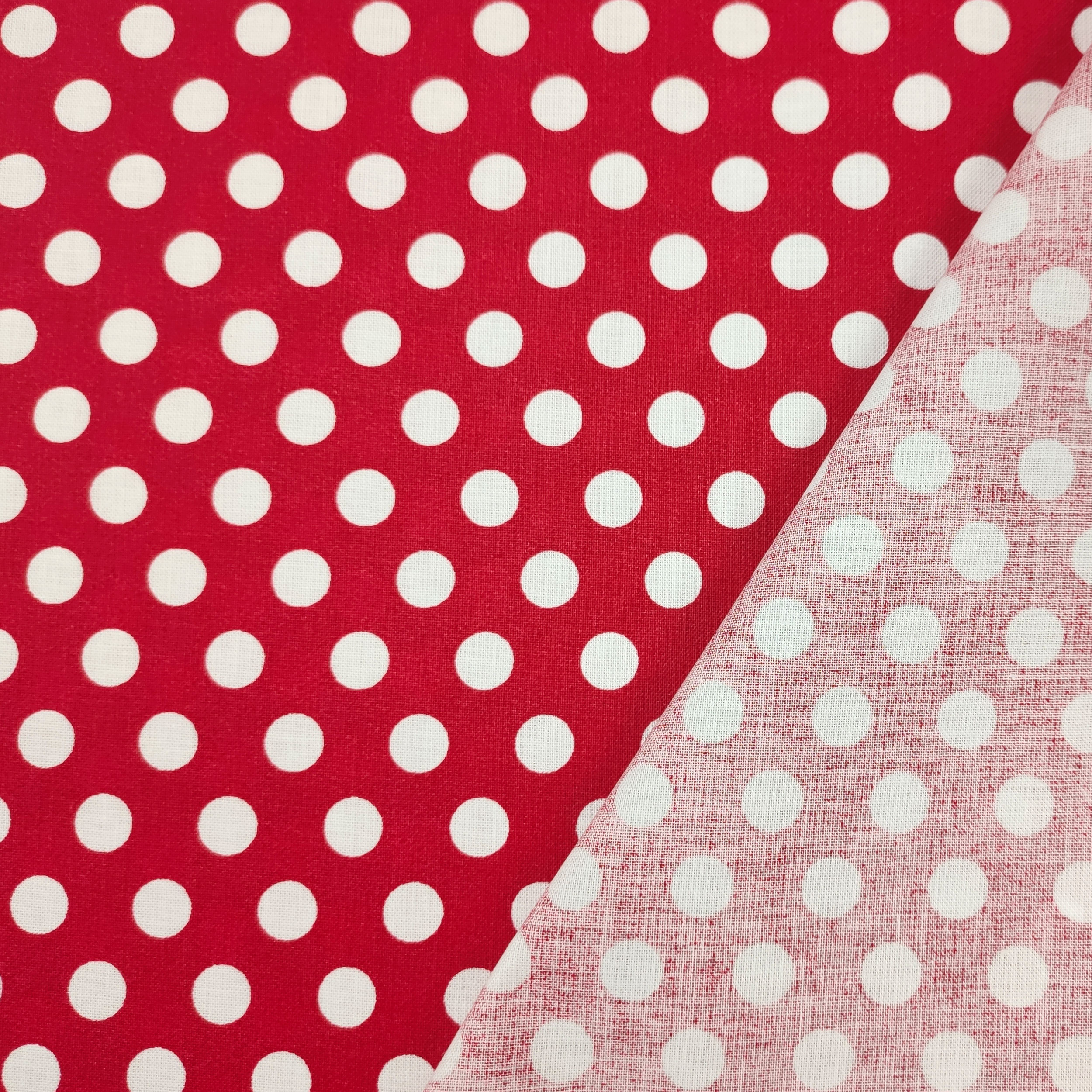 Roter Baumwollstoff mit großen Polka Dots