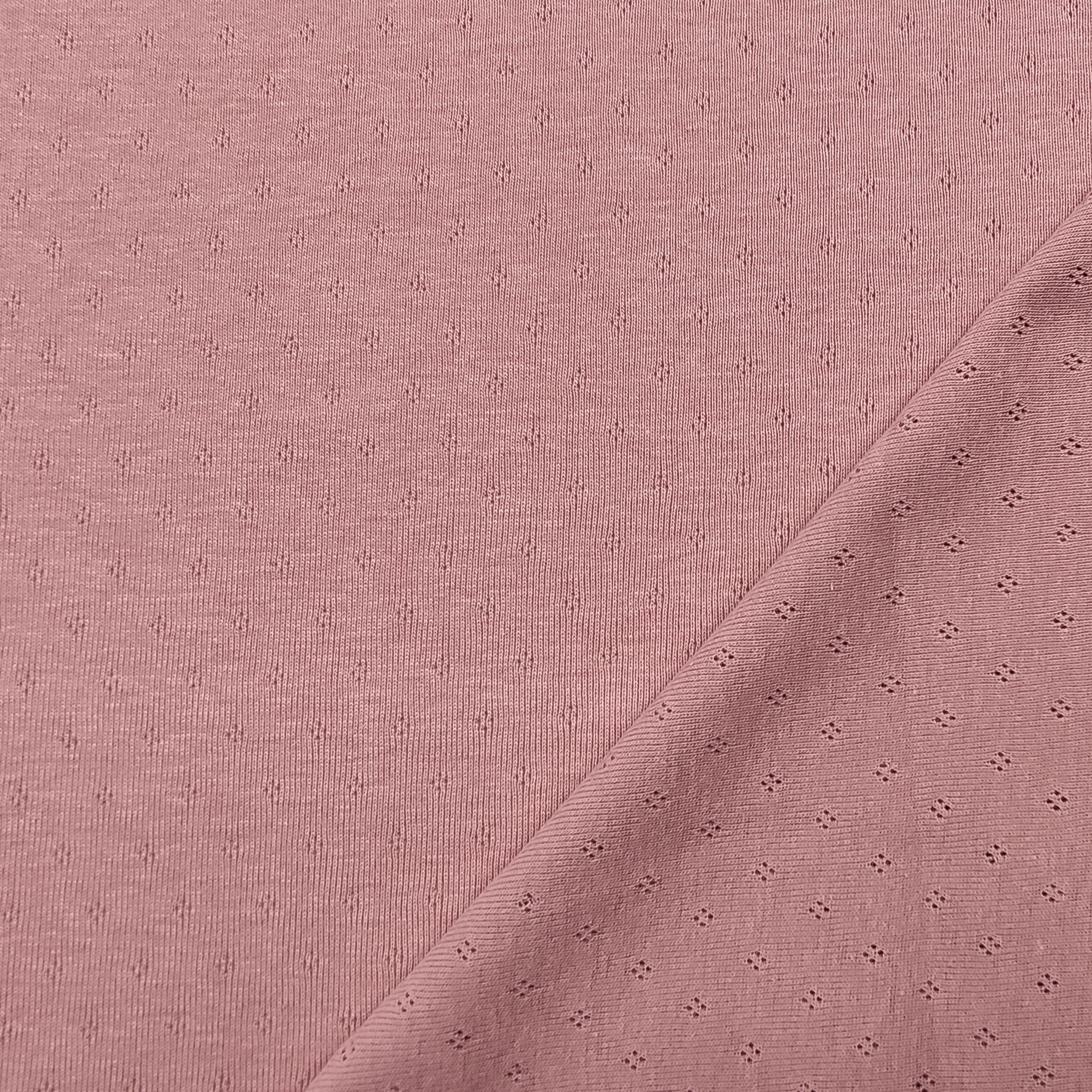 Jersey Cotton Jersey Perforated Flowers on a Pink Background Image
