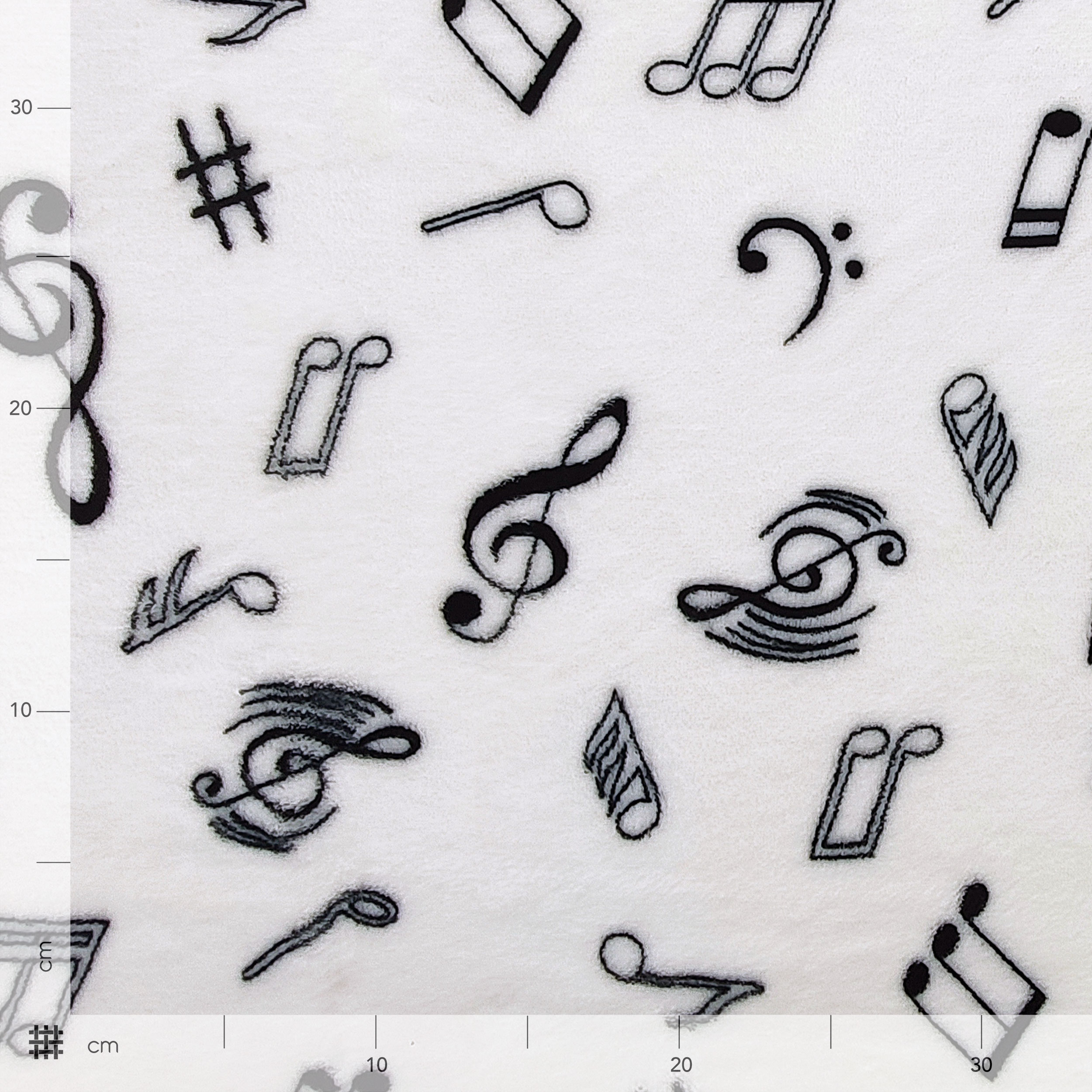 Vellón de cachemira blanco con notas musicales