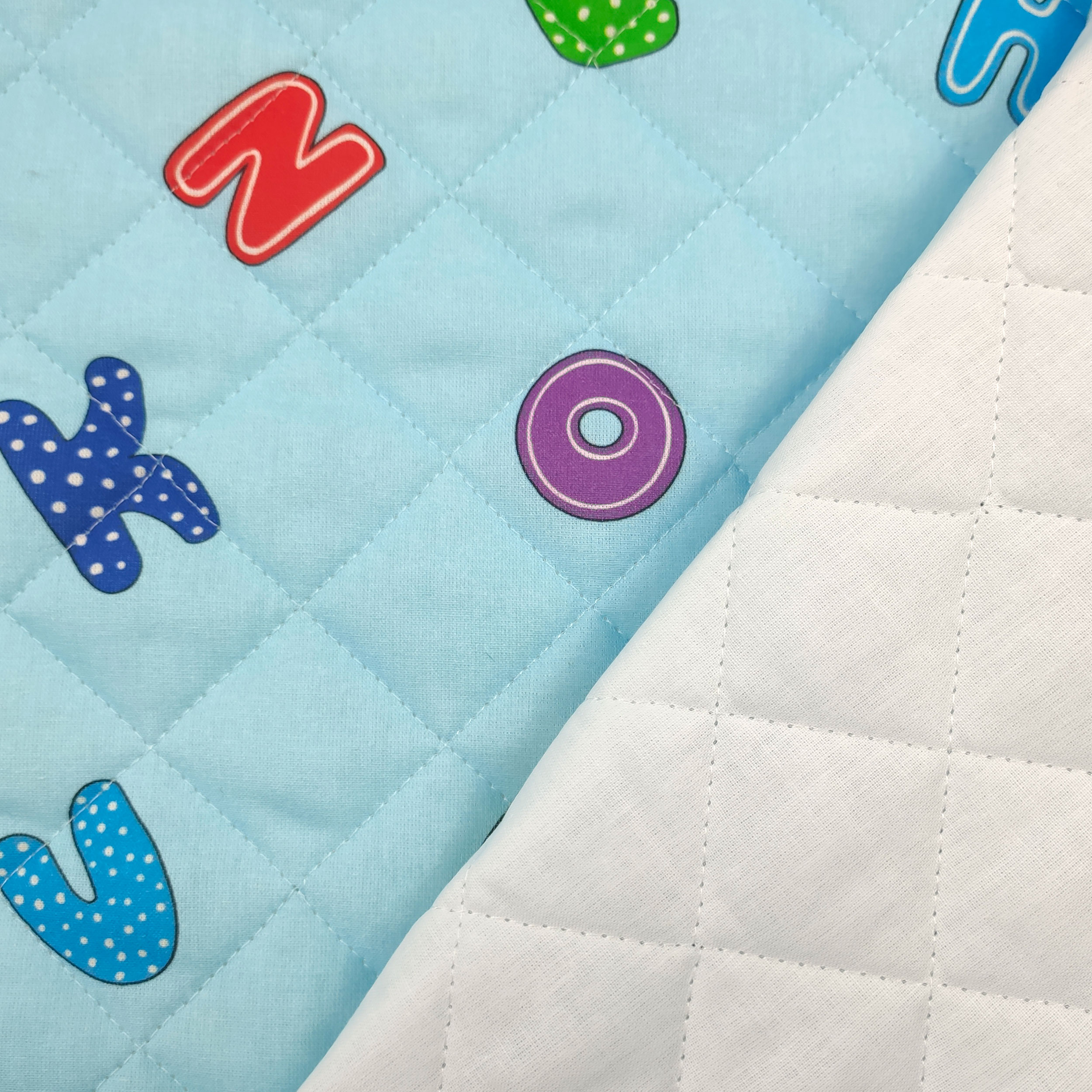 Alphabet Quilted Fabric Light Blue Background Image