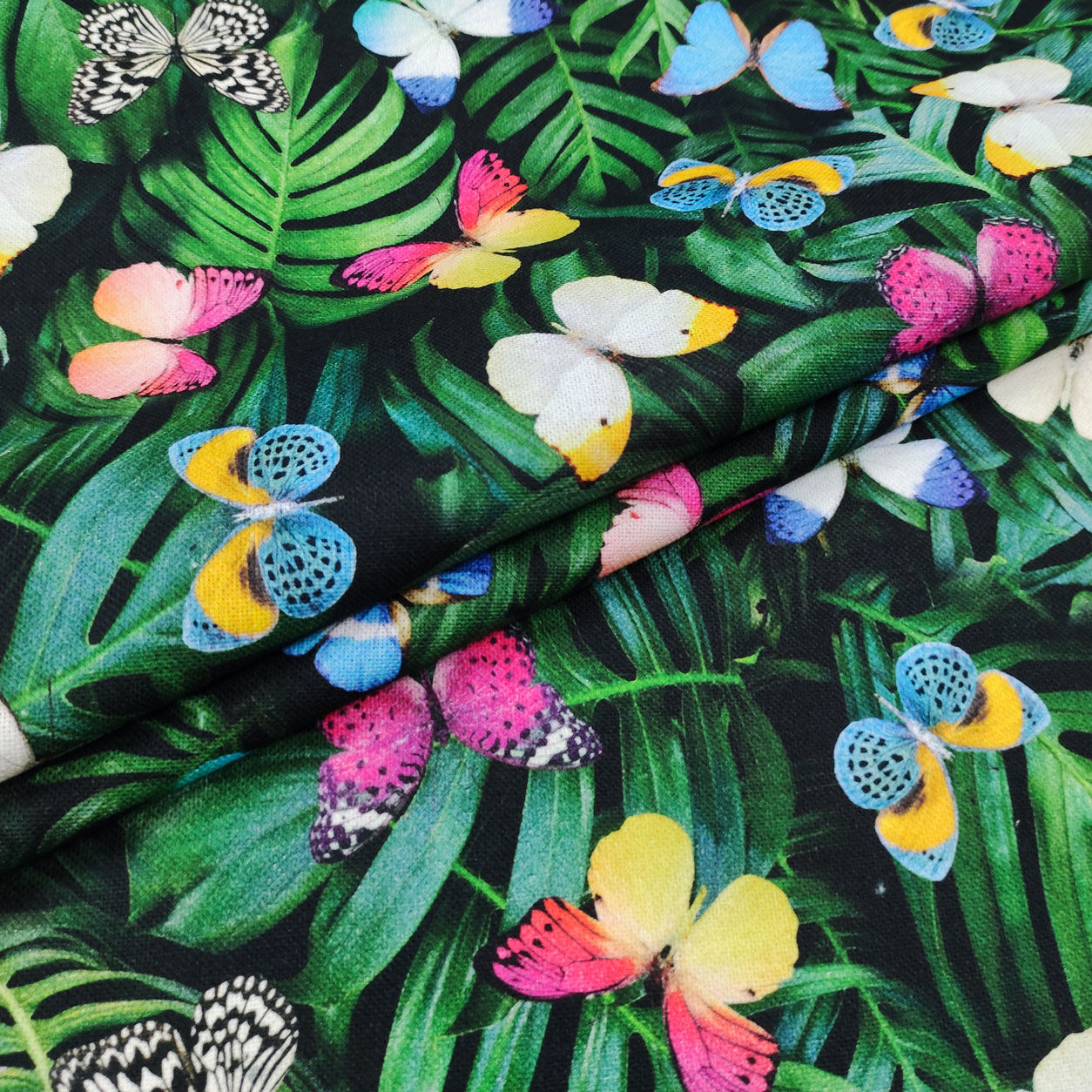 tessuto-panama-di-cotone-farfalle-e-foglie-tropicali