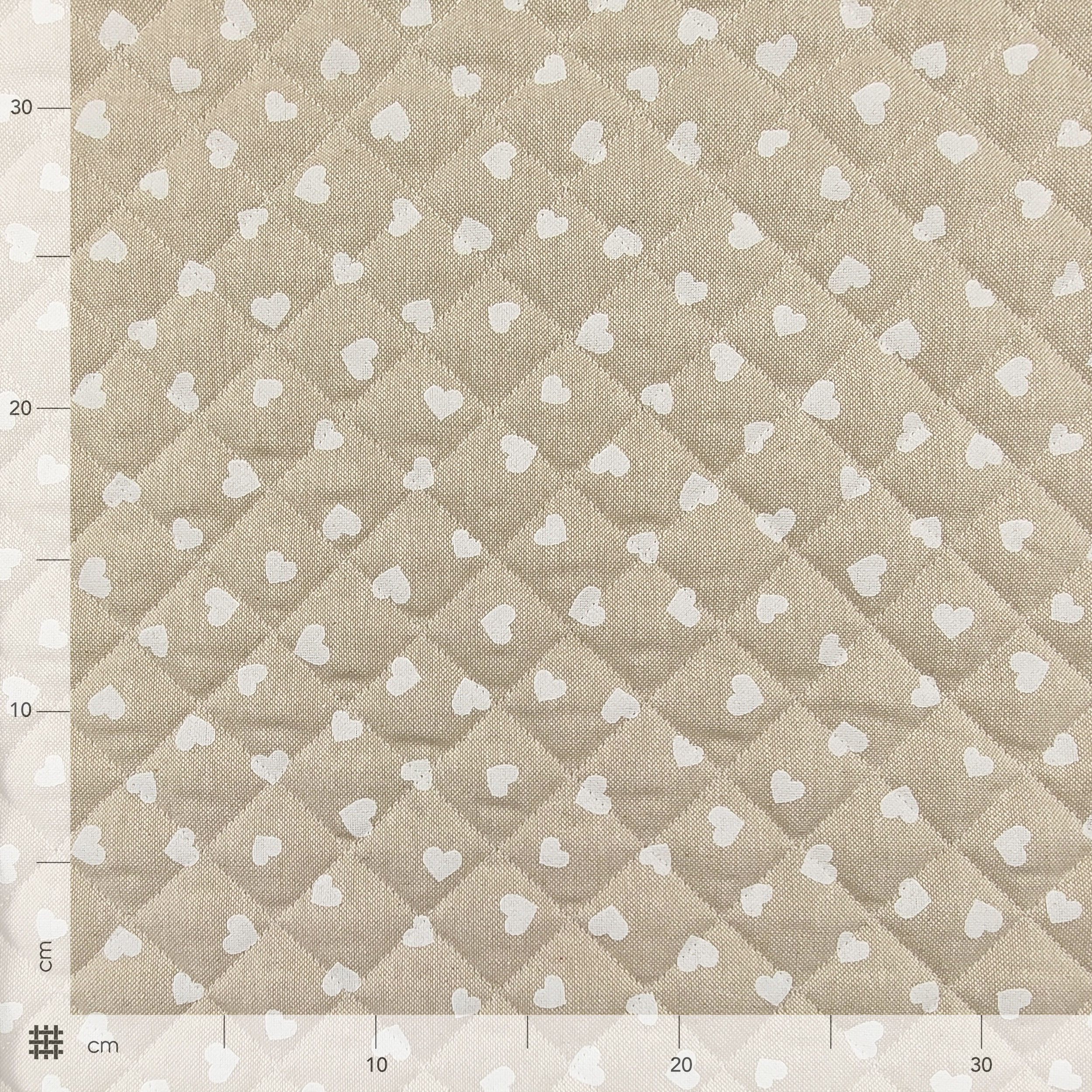 Quilted Fabric White Hearts Beige Background