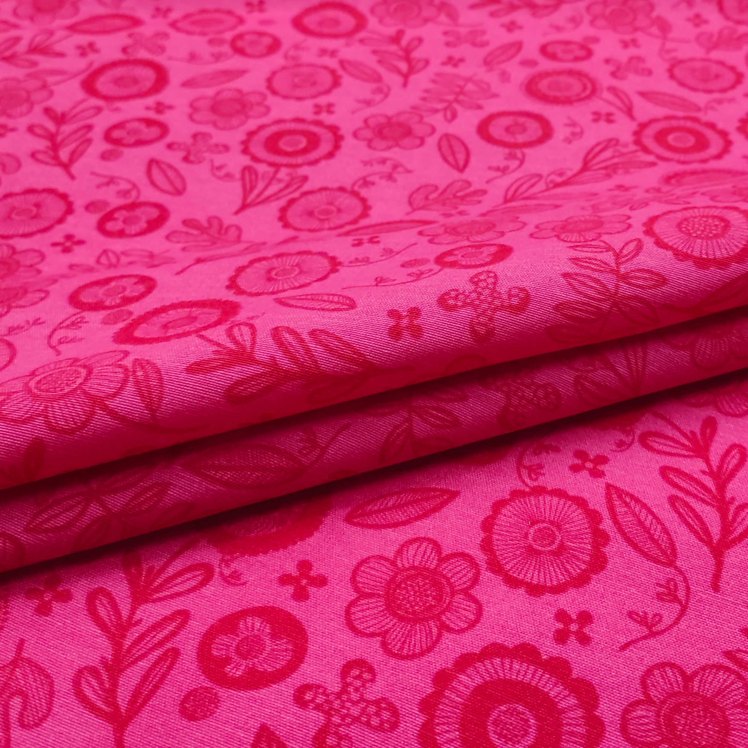 Tejido de algodón con estampado de flores Fuxia